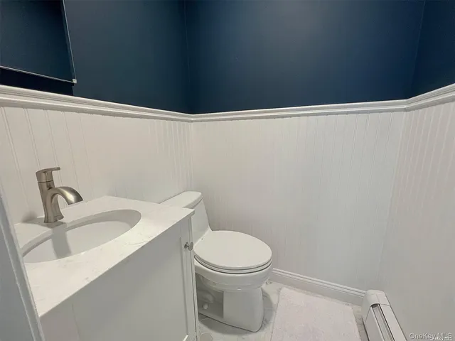 a bathroom with a toilet and sink