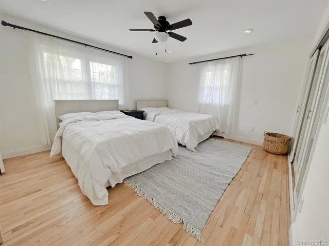 a bedroom with double bed and a window