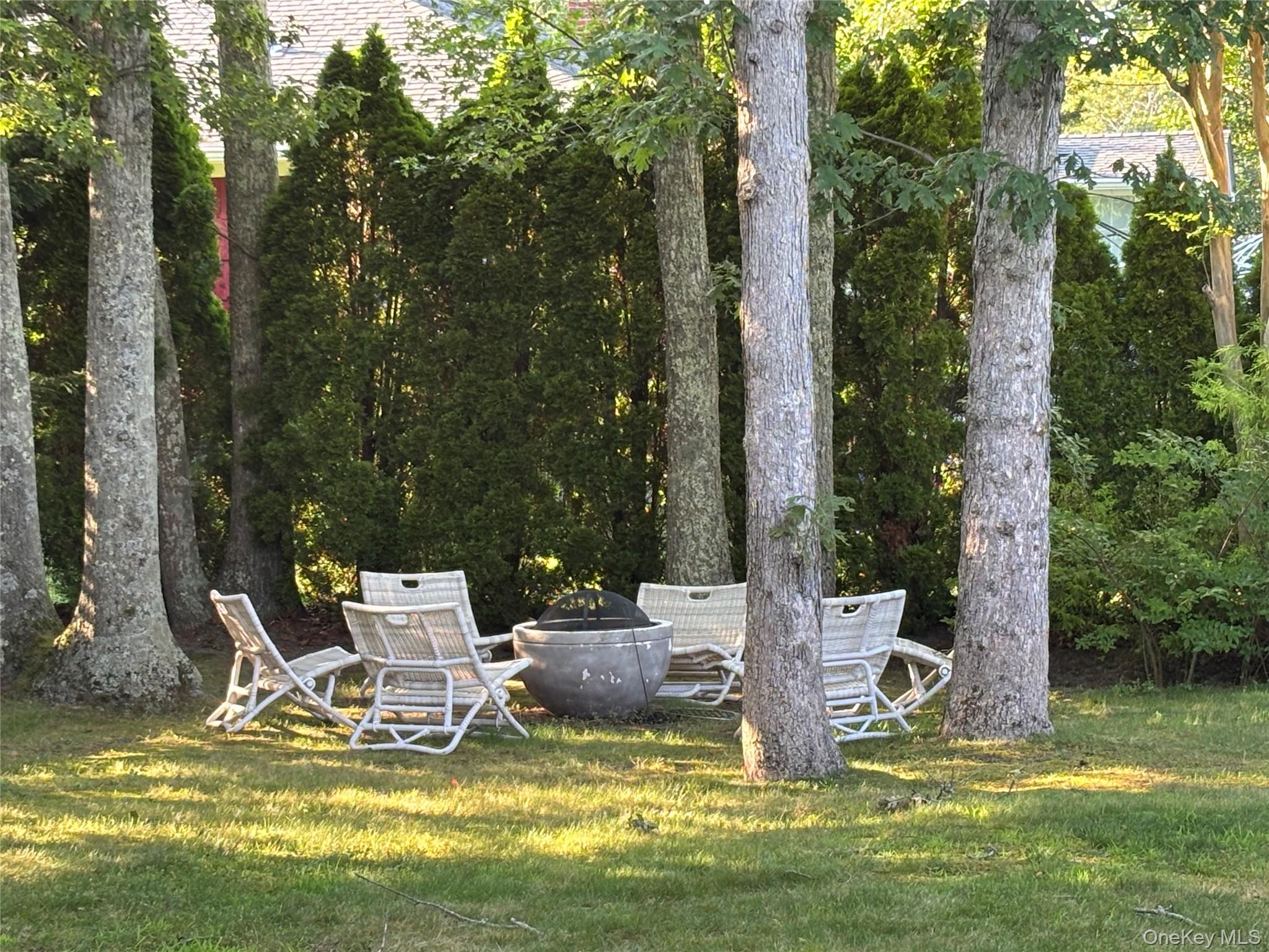 129 Lynncliff Road Hampton Bays, NY 11946 - Photo 18 of 24 a view of a swimming pool with a patio