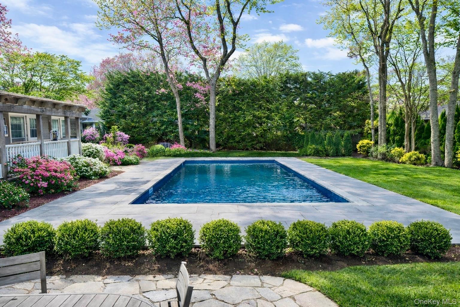 129 Lynncliff Road Hampton Bays, NY 11946 - Photo 2 of 24 a view of a backyard
