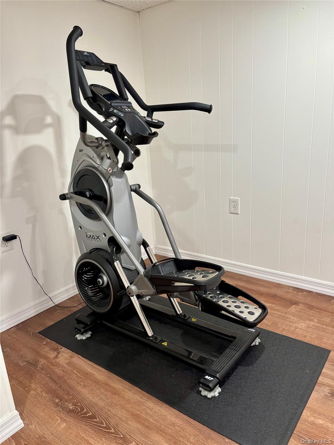 129 Lynncliff Road Hampton Bays, NY 11946 - Photo 22 of 24 a view of a room with gym equipment