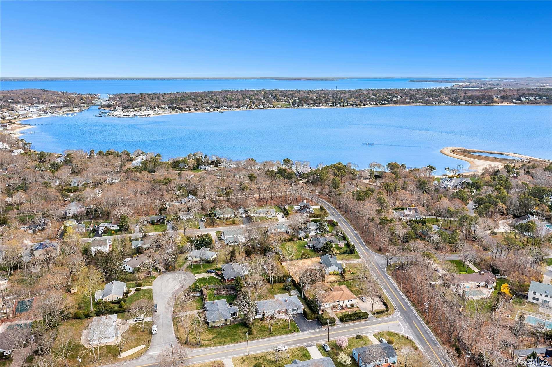 129 Lynncliff Road Hampton Bays, NY 11946 - Photo 3 of 24 a view of a city and an ocean
