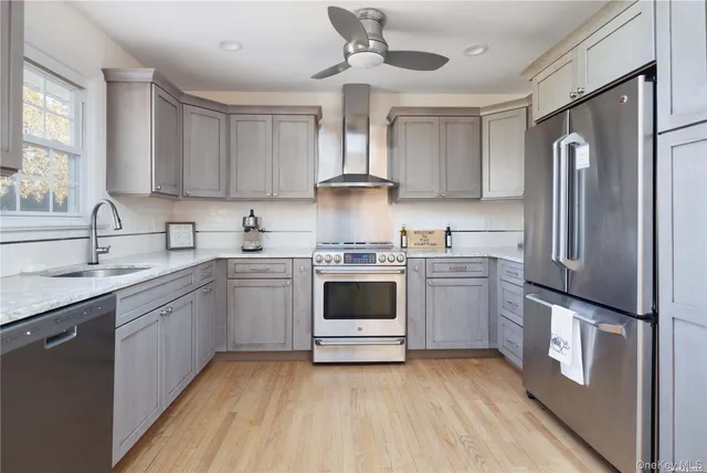 a kitchen with a stove sink and refrigerator