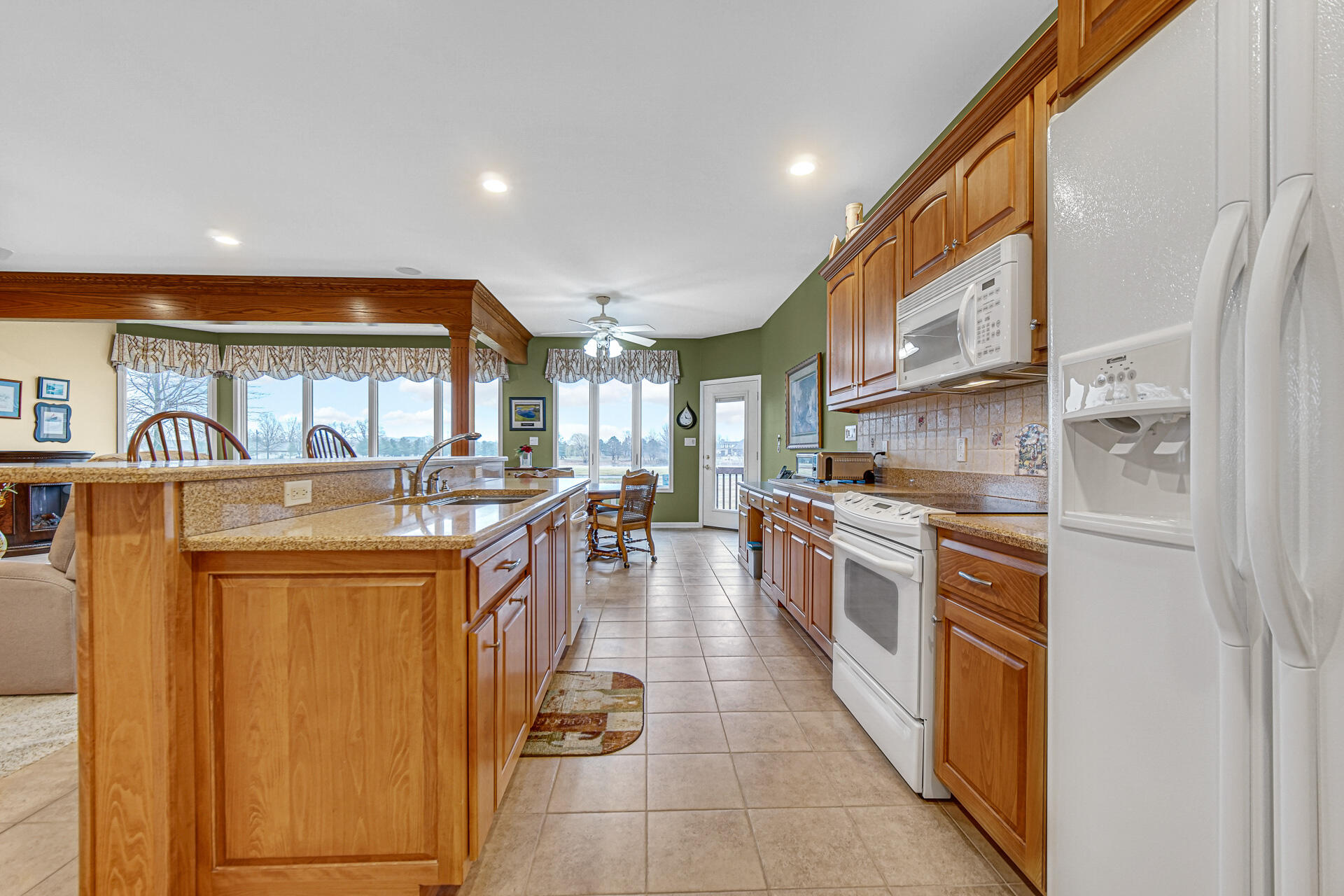 1718 Silver Hawk Drive Crown Point, IN 46307 - Photo 11 of 29 a kitchen with stainless steel appliances granite countertop a stove and a refrigerator
