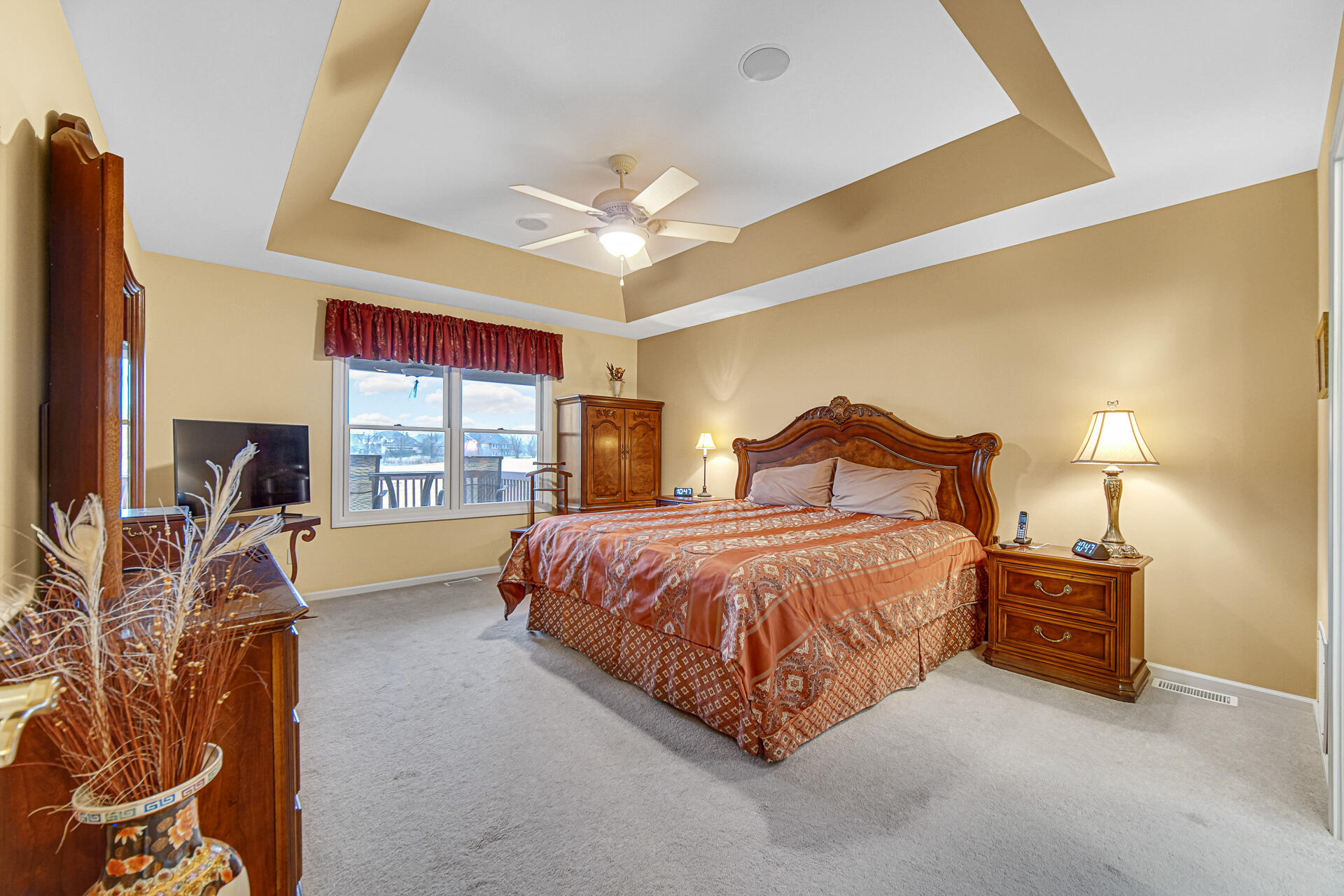 1718 Silver Hawk Drive Crown Point, IN 46307 - Photo 13 of 29 a spacious bedroom with a bed and a lamp