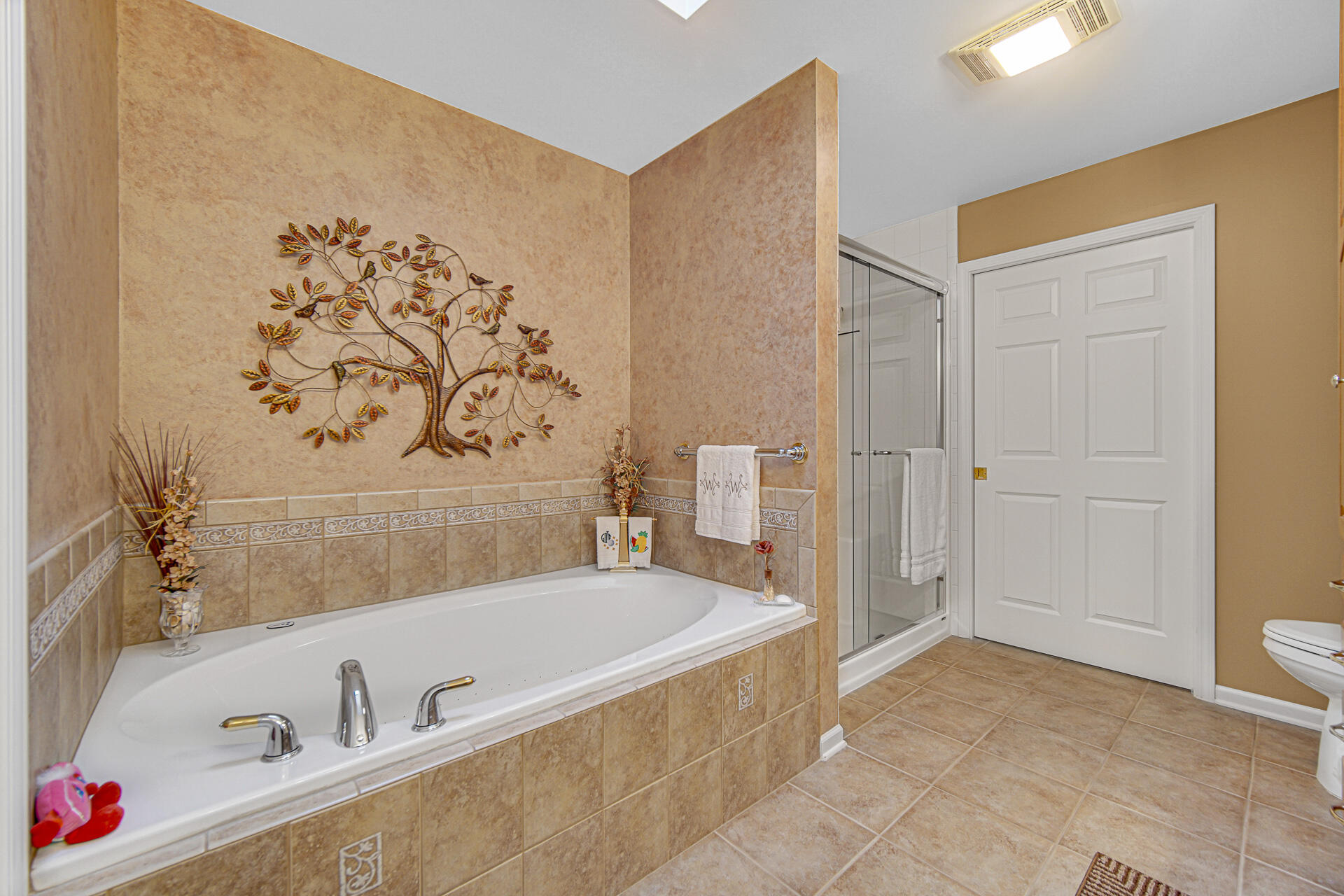 1718 Silver Hawk Drive Crown Point, IN 46307 - Photo 14 of 29 a bathroom with a bathtub and a shower