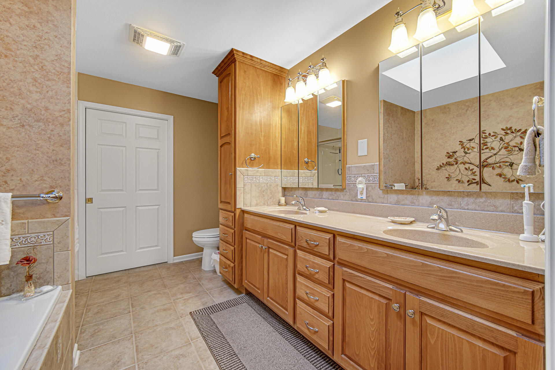 1718 Silver Hawk Drive Crown Point, IN 46307 - Photo 15 of 29 a spacious bathroom with a double vanity sink mirror and double