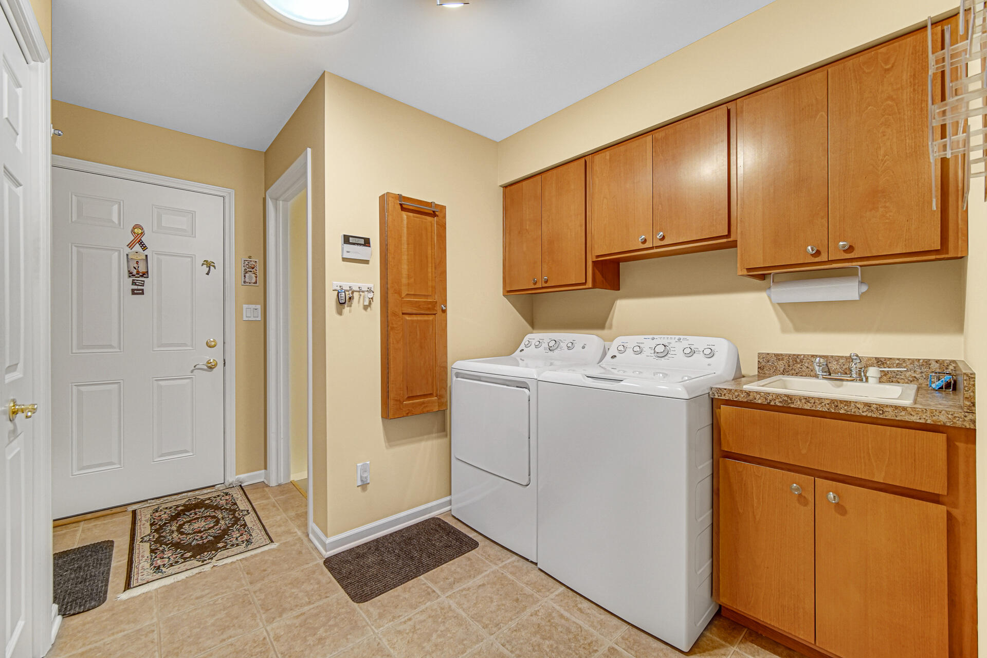 1718 Silver Hawk Drive Crown Point, IN 46307 - Photo 19 of 29 a view of a storage & utility room with closet dryer and washer