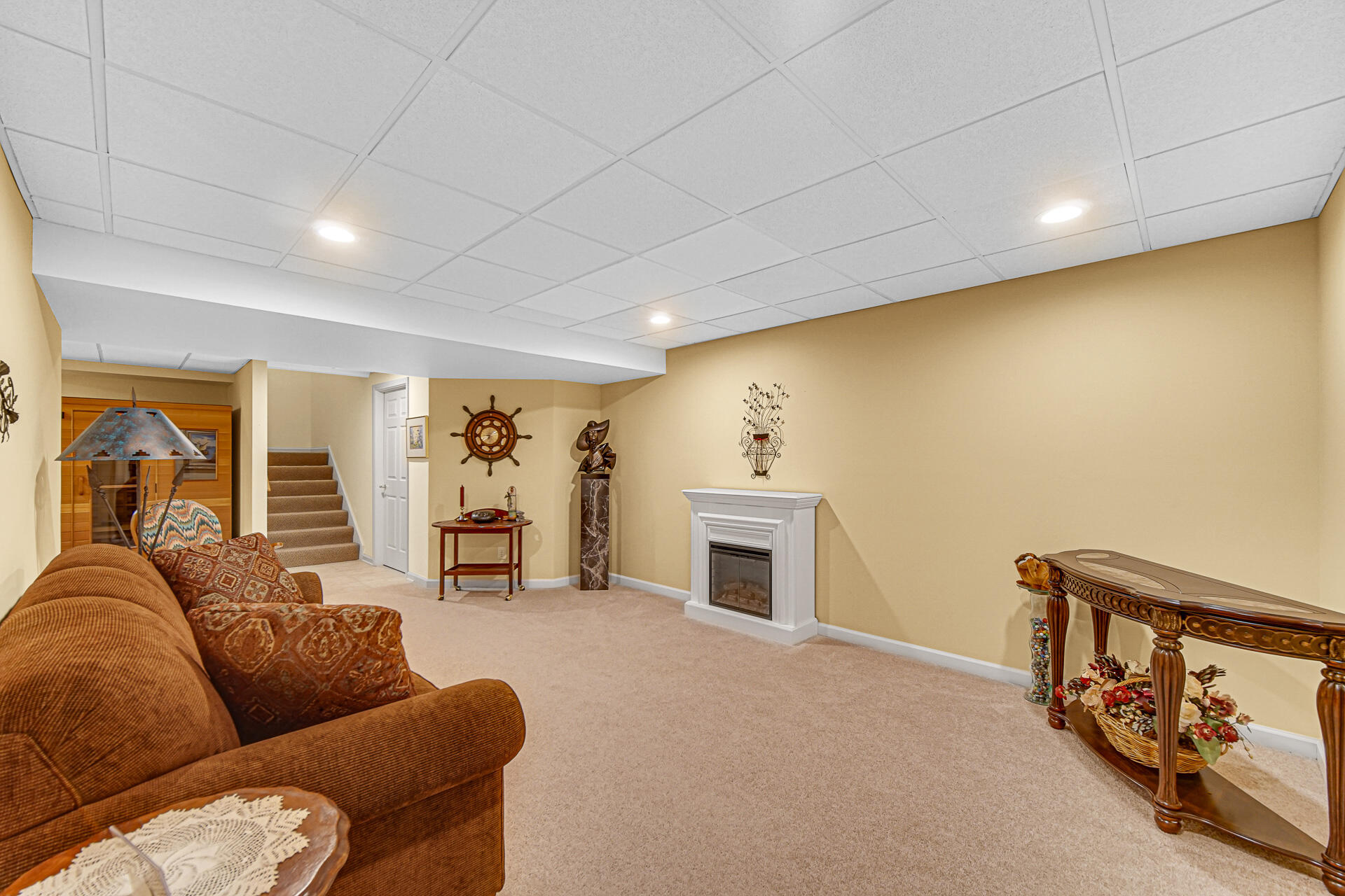 1718 Silver Hawk Drive Crown Point, IN 46307 - Photo 24 of 29 a living room with furniture and a fireplace