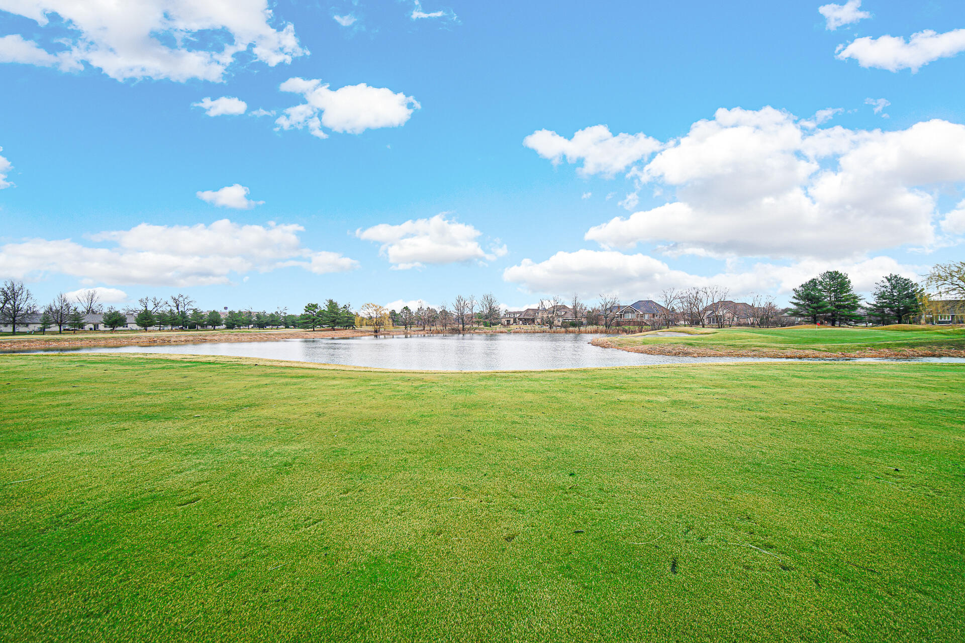 1718 Silver Hawk Drive Crown Point, IN 46307 - Photo 27 of 29 a view of a lake with houses in the background
