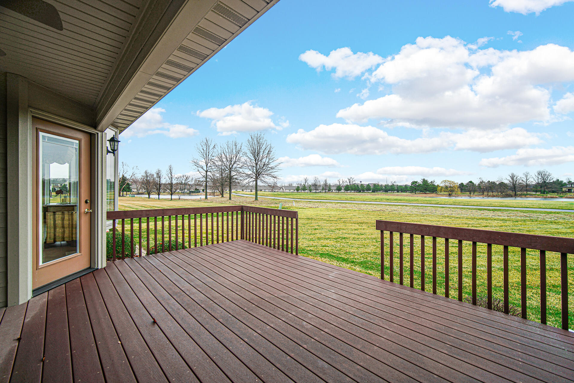1718 Silver Hawk Drive Crown Point, IN 46307 - Photo 28 of 29 a view of river and deck with wooden floor and fence
