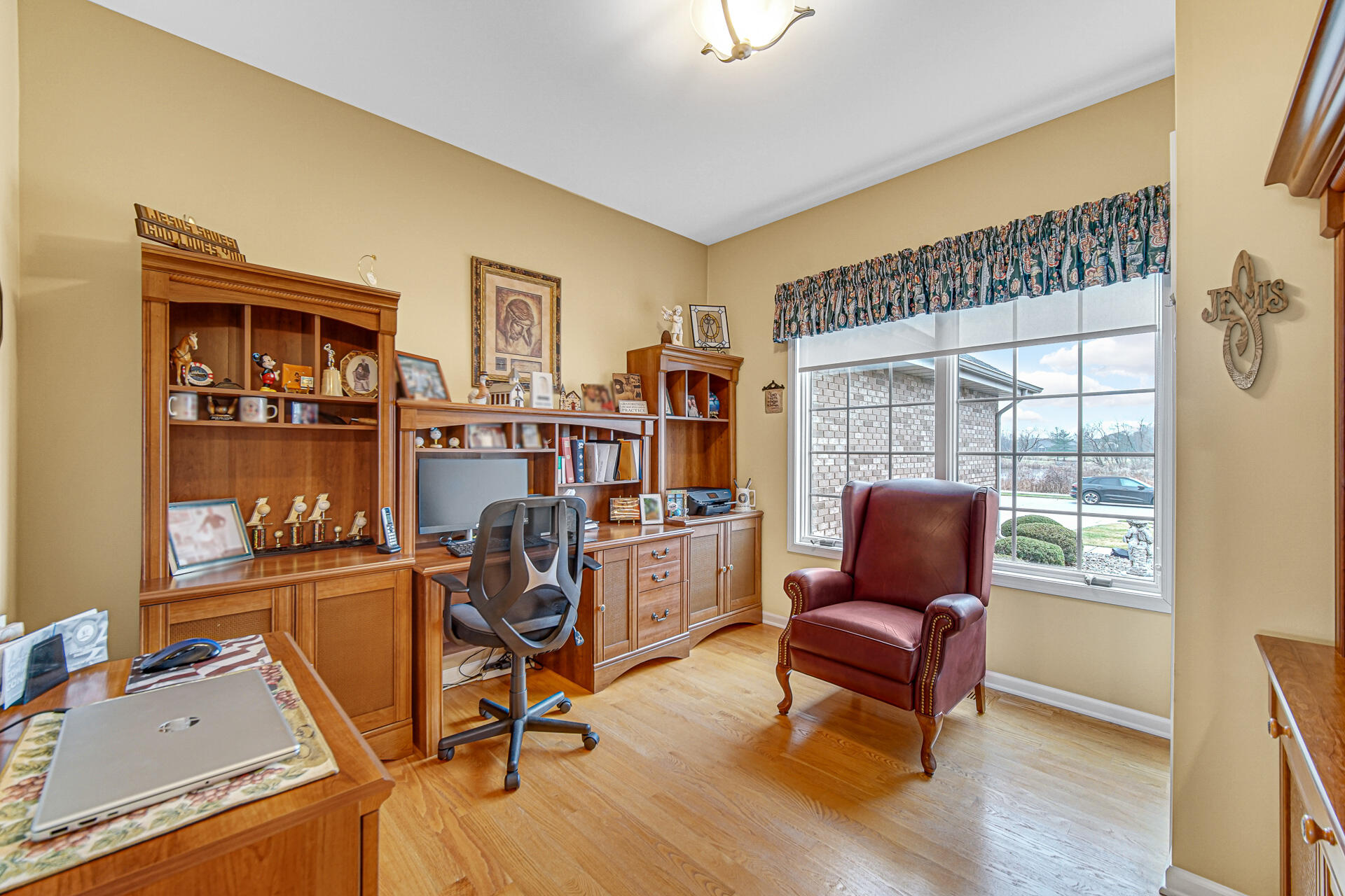 1718 Silver Hawk Drive Crown Point, IN 46307 - Photo 7 of 29 a view of a workspace with furniture and a window