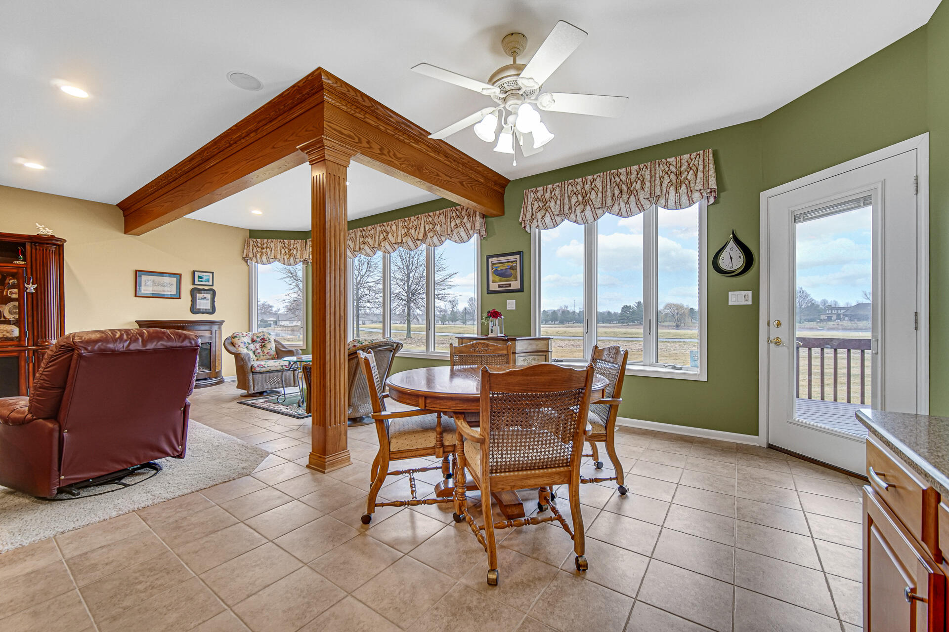1718 Silver Hawk Drive Crown Point, IN 46307 - Photo 8 of 29 a dining room with furniture a chandelier and wooden floor