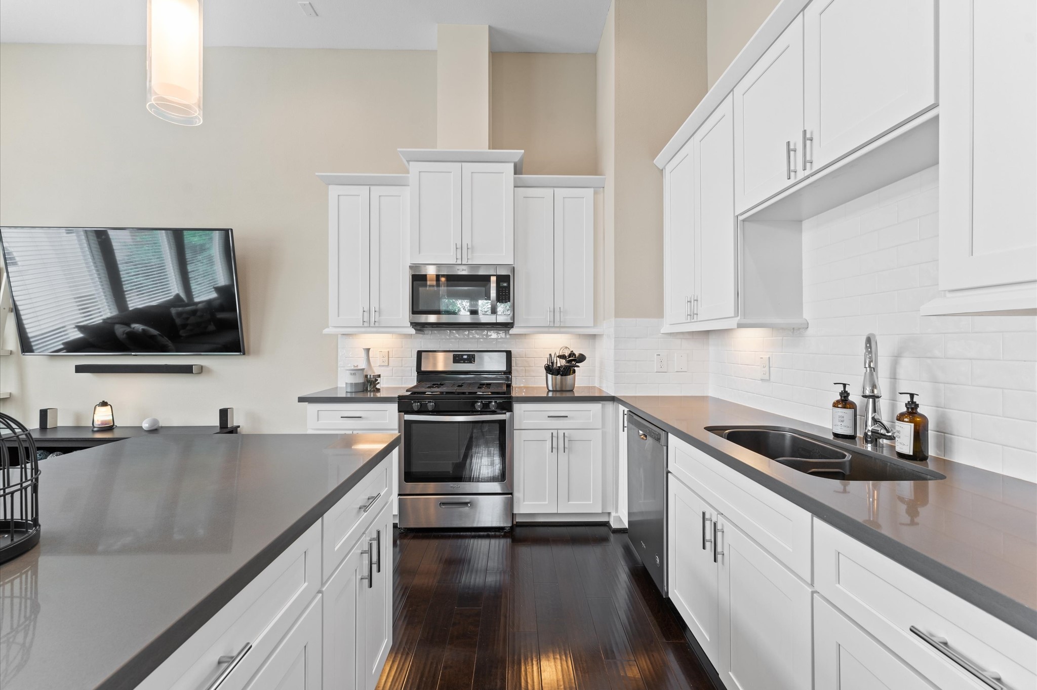 2422 Cochran Street Houston, TX 77009 - Photo 11 of 31 Stunning countertops offer a nice accent color to the white cabinets and subway tile. There is plenty of space to whip up all your favorite meals.