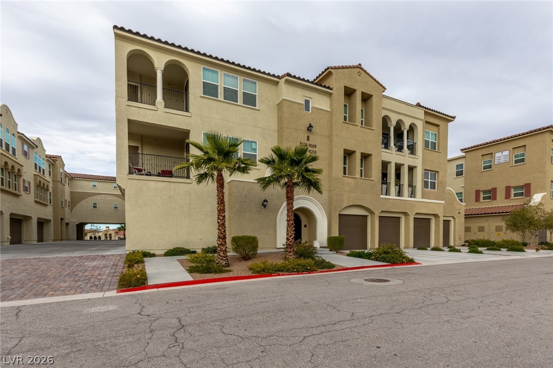 2555 Hampton Road, Unit 8206 Henderson, NV 89052 - Photo 34 of 35 This multi-story dwelling features Mediterranean-inspired architecture and lush landscaping.