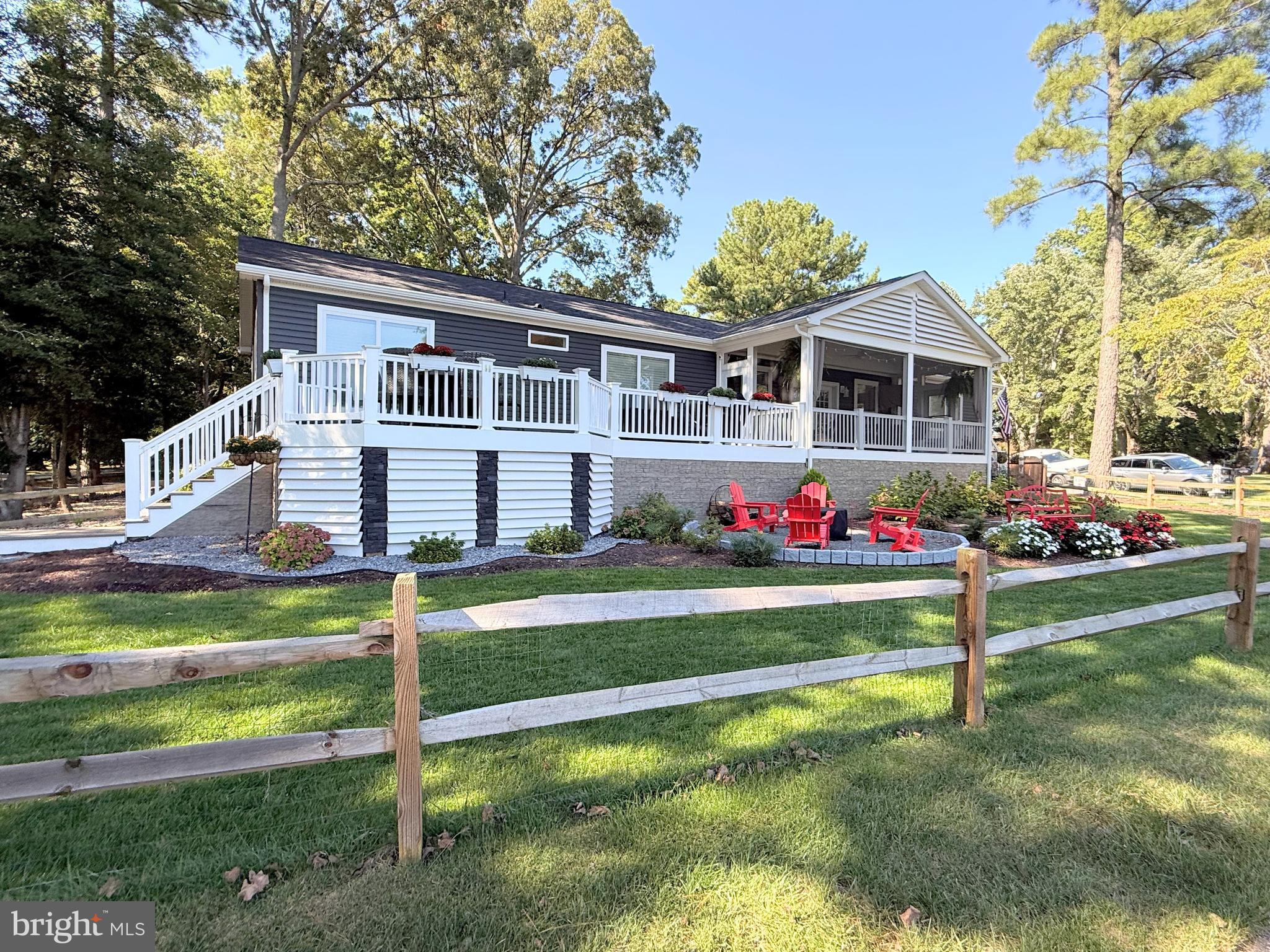 a front view of a house with a yard table and chairs
