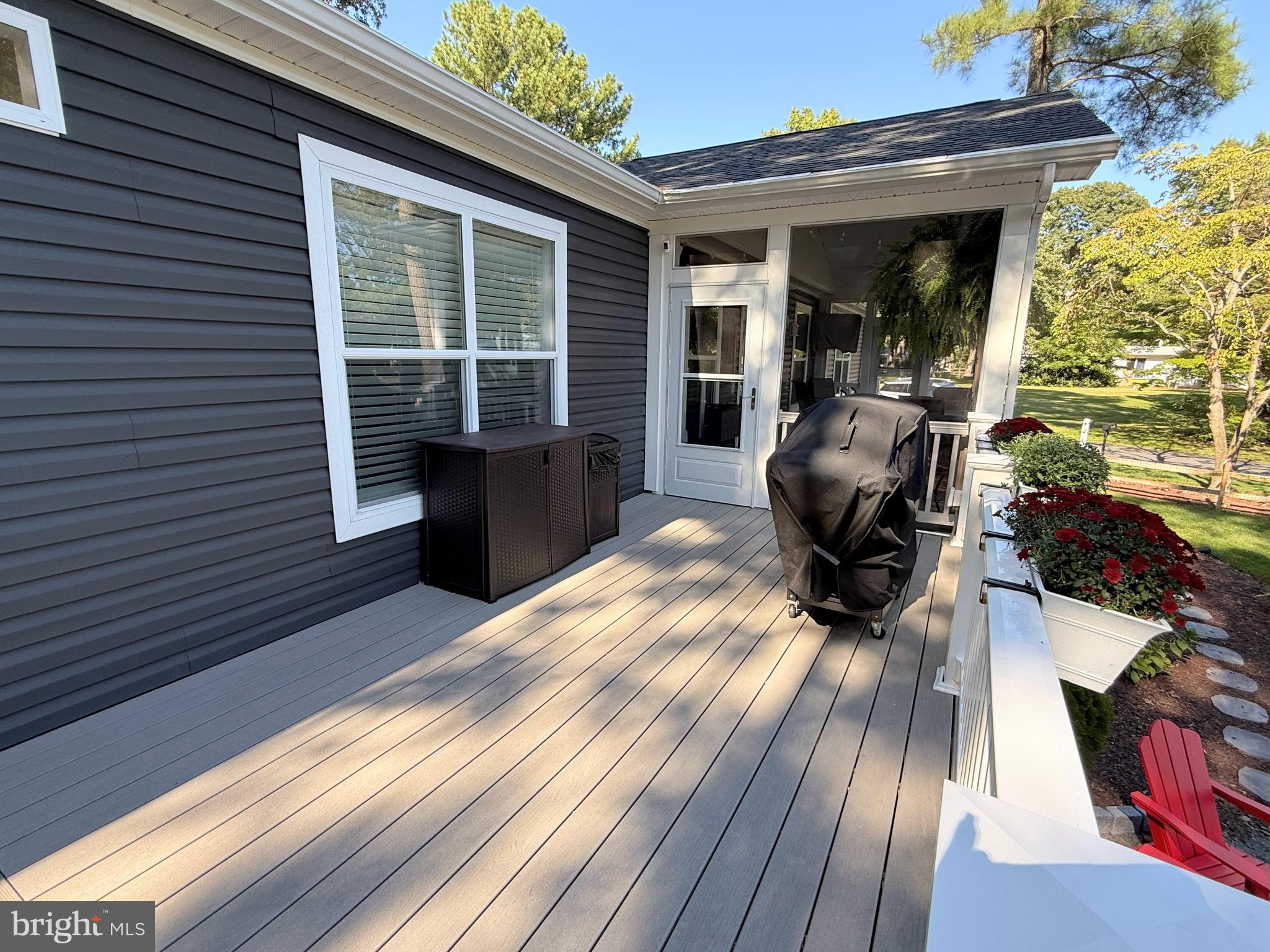 26908 Wood Duck Road, Unit 611 Long Neck, DE 19966 - Photo 14 of 80 a view of a chairs and table in a balcony