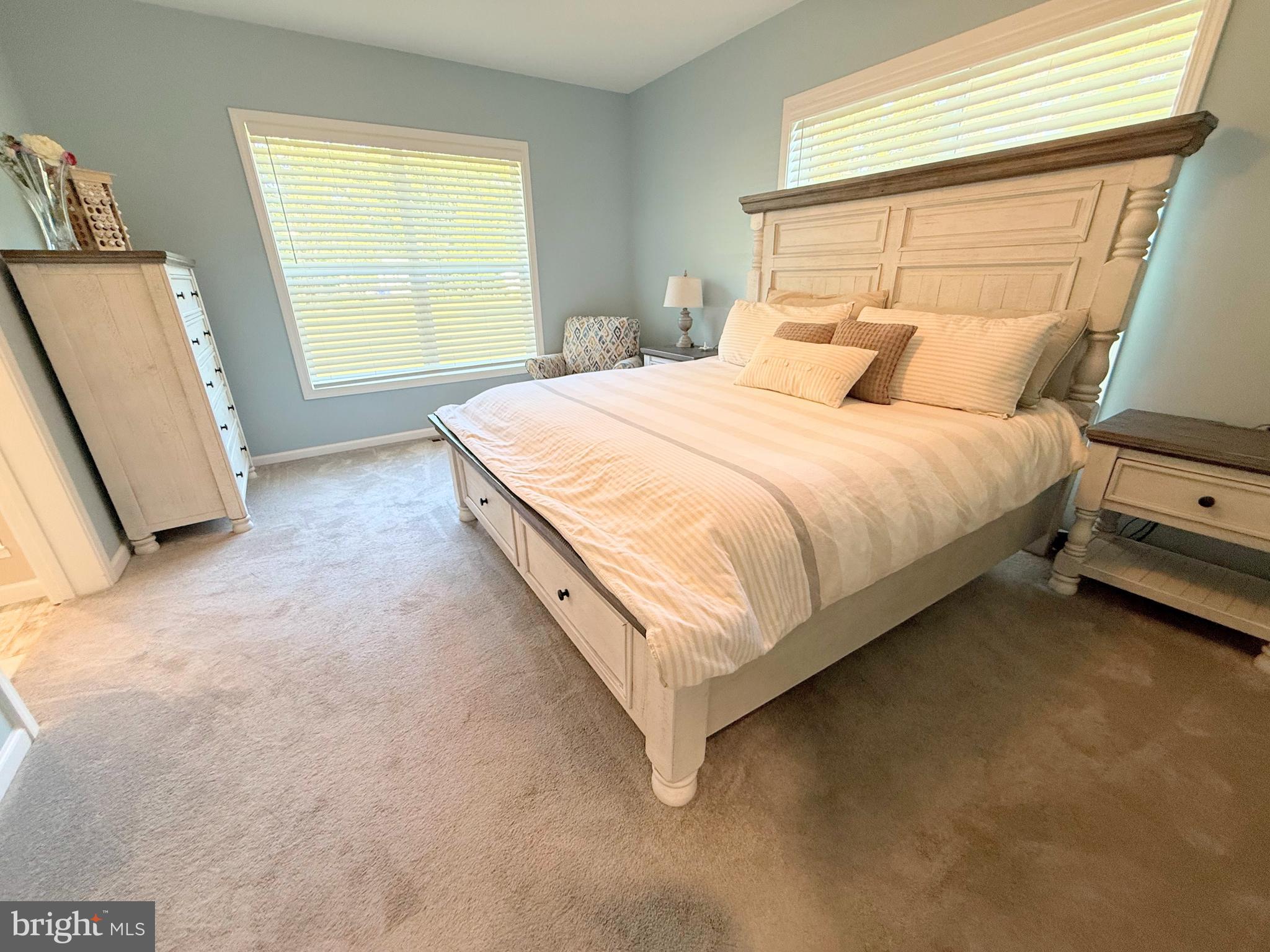 26908 Wood Duck Road, Unit 611 Long Neck, DE 19966 - Photo 42 of 80 a bedroom with a bed and a window