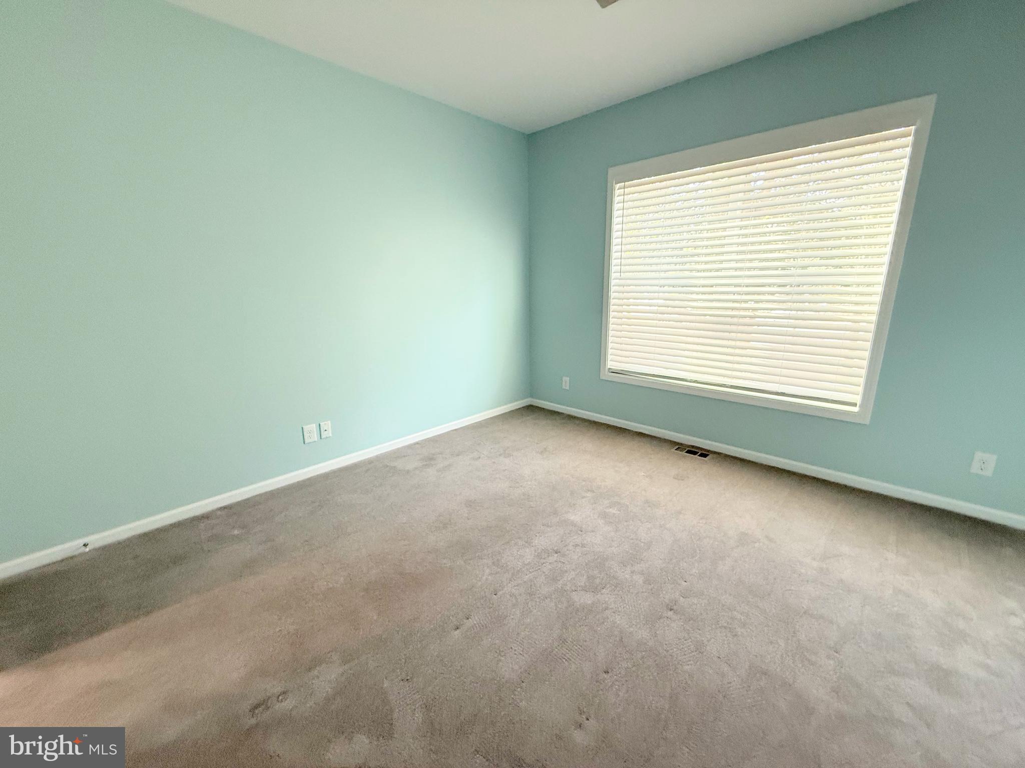 26908 Wood Duck Road, Unit 611 Long Neck, DE 19966 - Photo 50 of 80 an empty room with a window