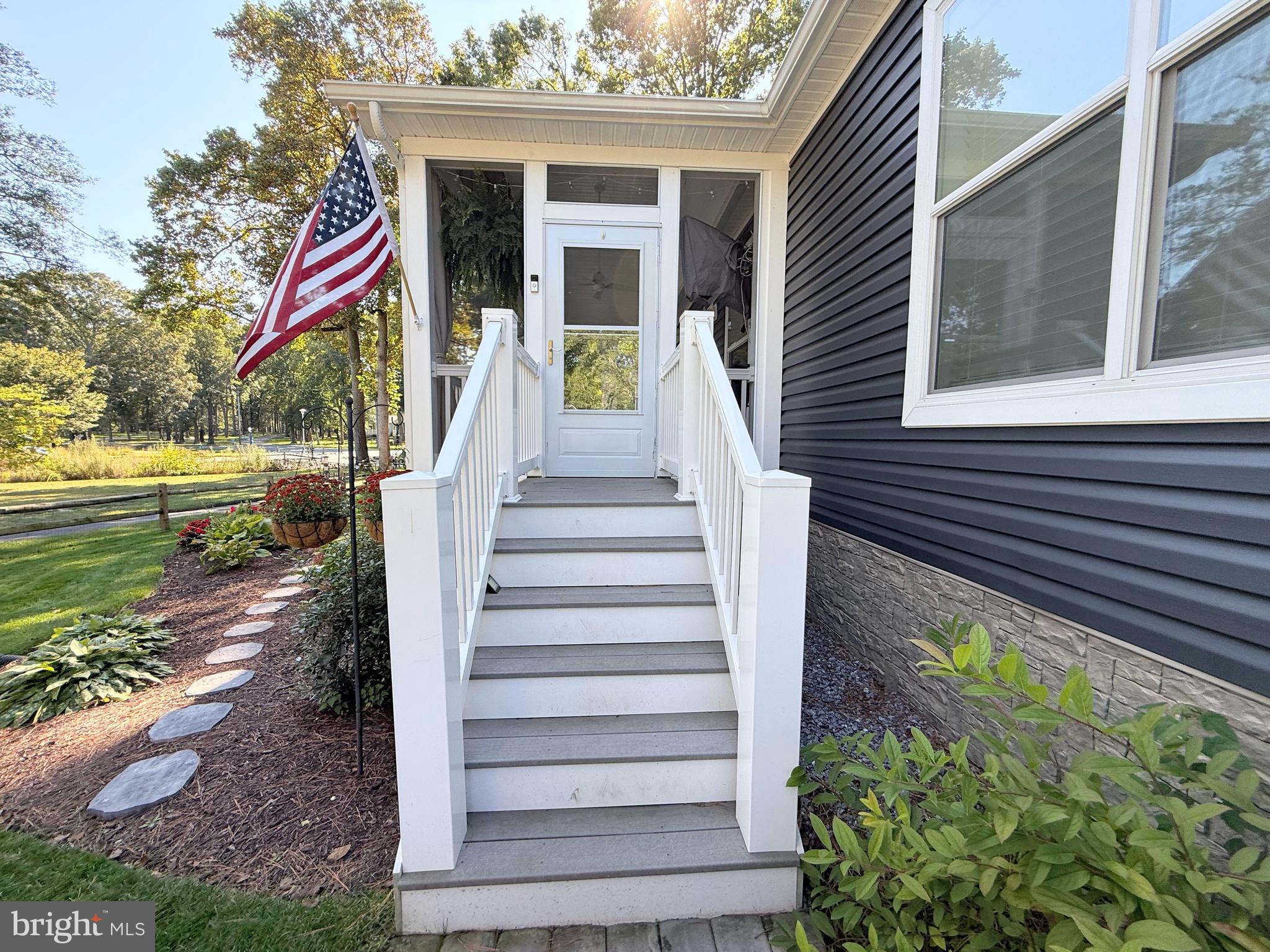 26908 Wood Duck Road, Unit 611 Long Neck, DE 19966 - Photo 6 of 80 a view of a house with a yard