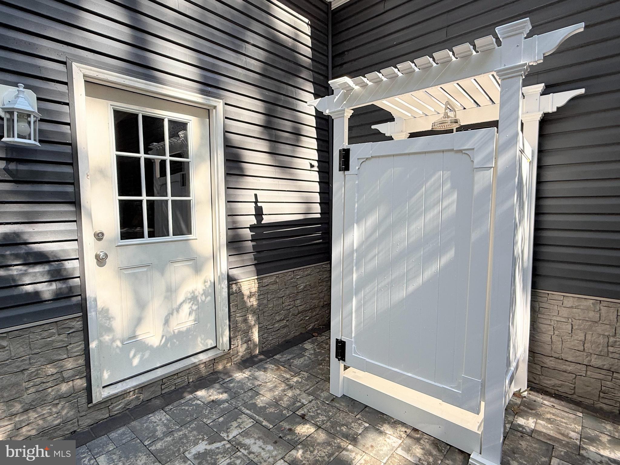 26908 Wood Duck Road, Unit 611 Long Neck, DE 19966 - Photo 76 of 80 a view of an entrance of the house