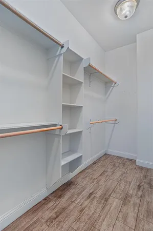 a view of an empty walk in closet