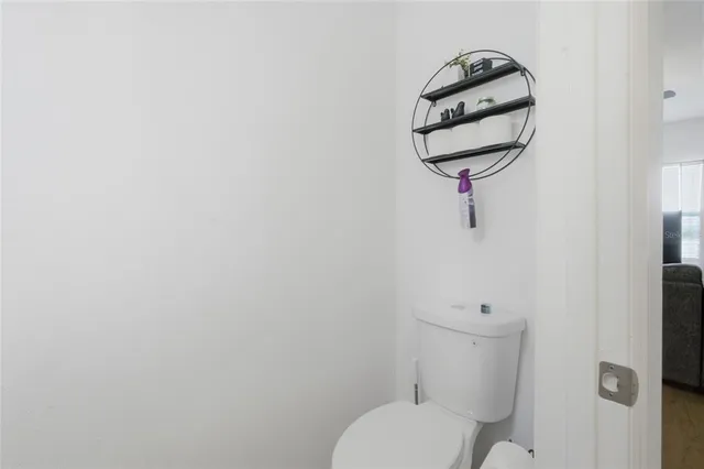 a bathroom with a toilet and a sink