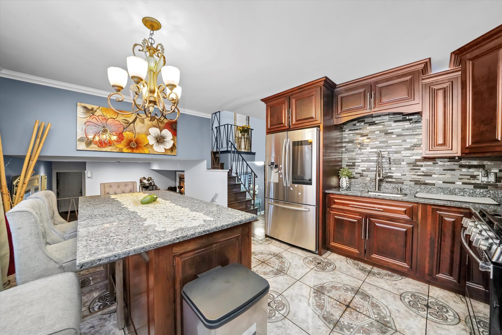 17702 Bernadine Street Lansing, IL 60438 - Photo 19 of 41 a kitchen with a stove a sink and a wooden cabinets