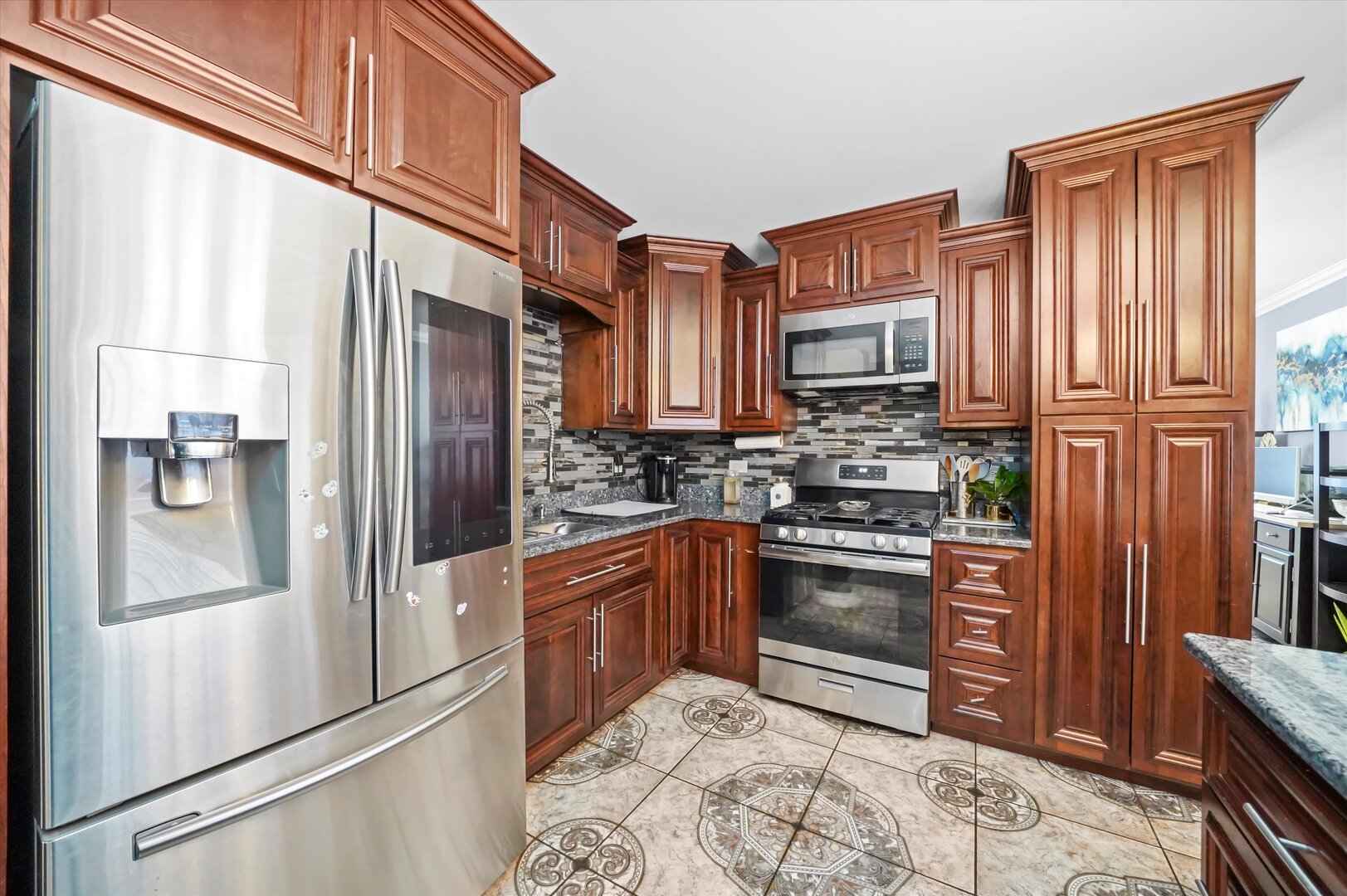 17702 Bernadine Street Lansing, IL 60438 - Photo 21 of 41 a kitchen with stainless steel appliances granite countertop a refrigerator stove and sink