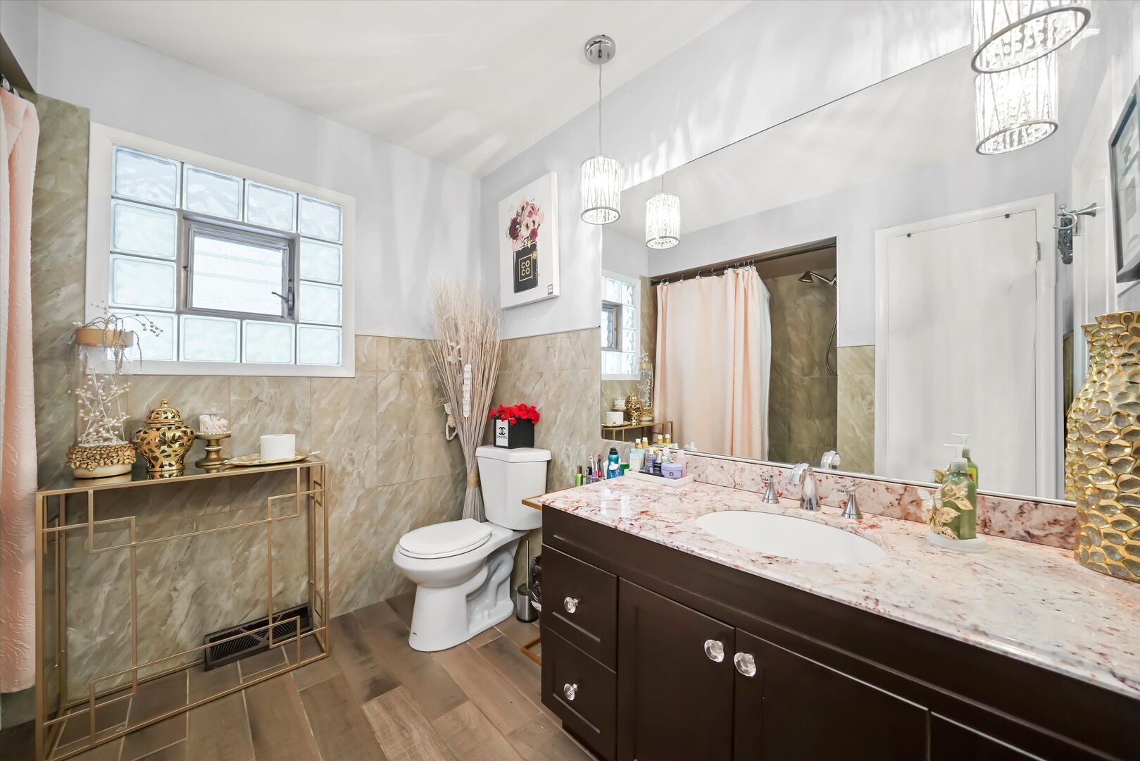 17702 Bernadine Street Lansing, IL 60438 - Photo 28 of 41 a bathroom with a granite countertop sink a toilet a large mirror and shower