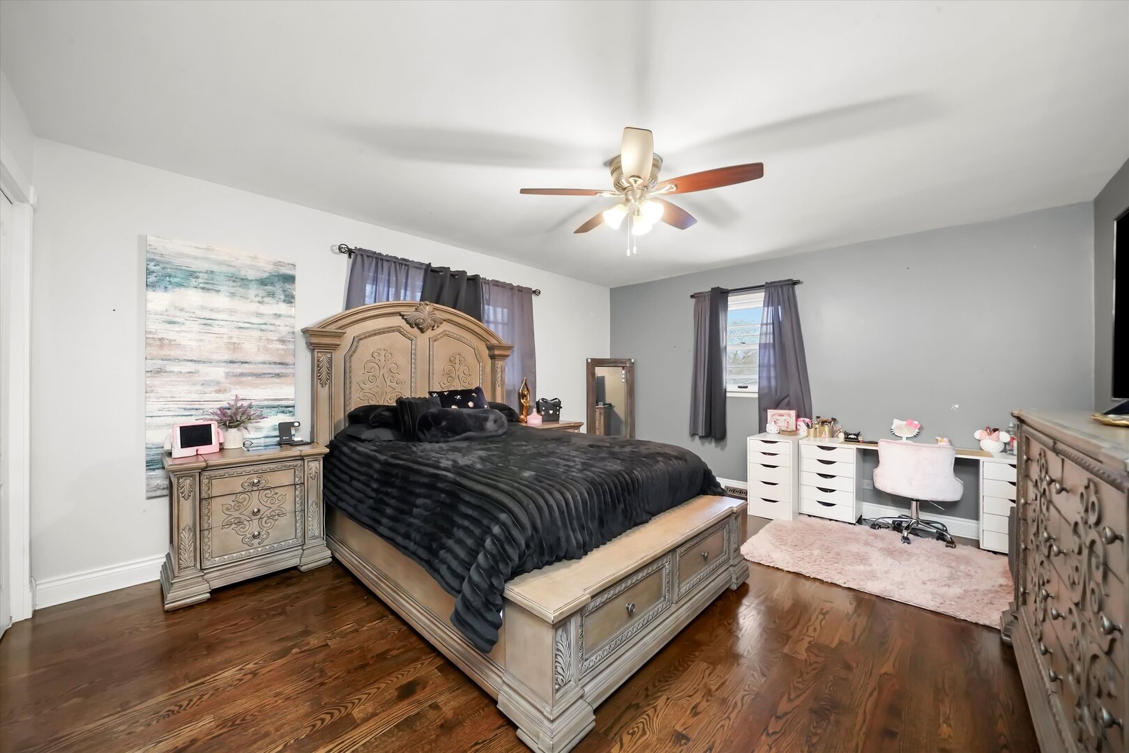 17702 Bernadine Street Lansing, IL 60438 - Photo 29 of 41 a spacious bedroom with a bed and a chandelier