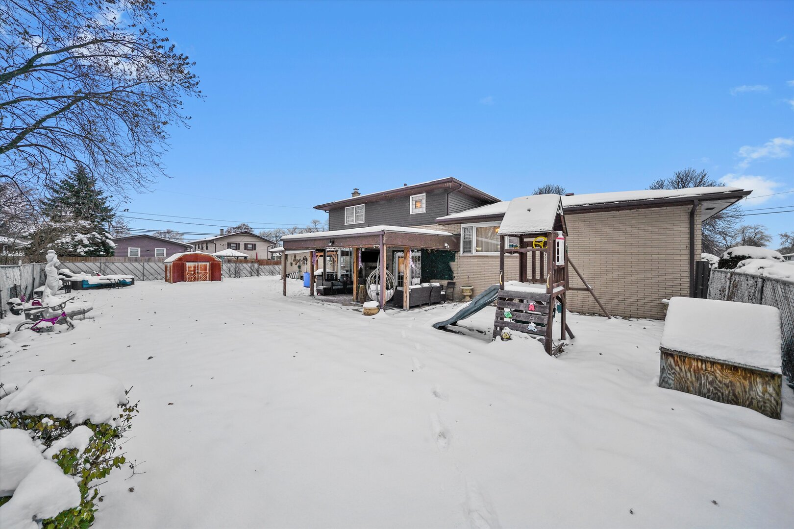 17702 Bernadine Street Lansing, IL 60438 - Photo 36 of 41 a view of a house with large trees and sitting area