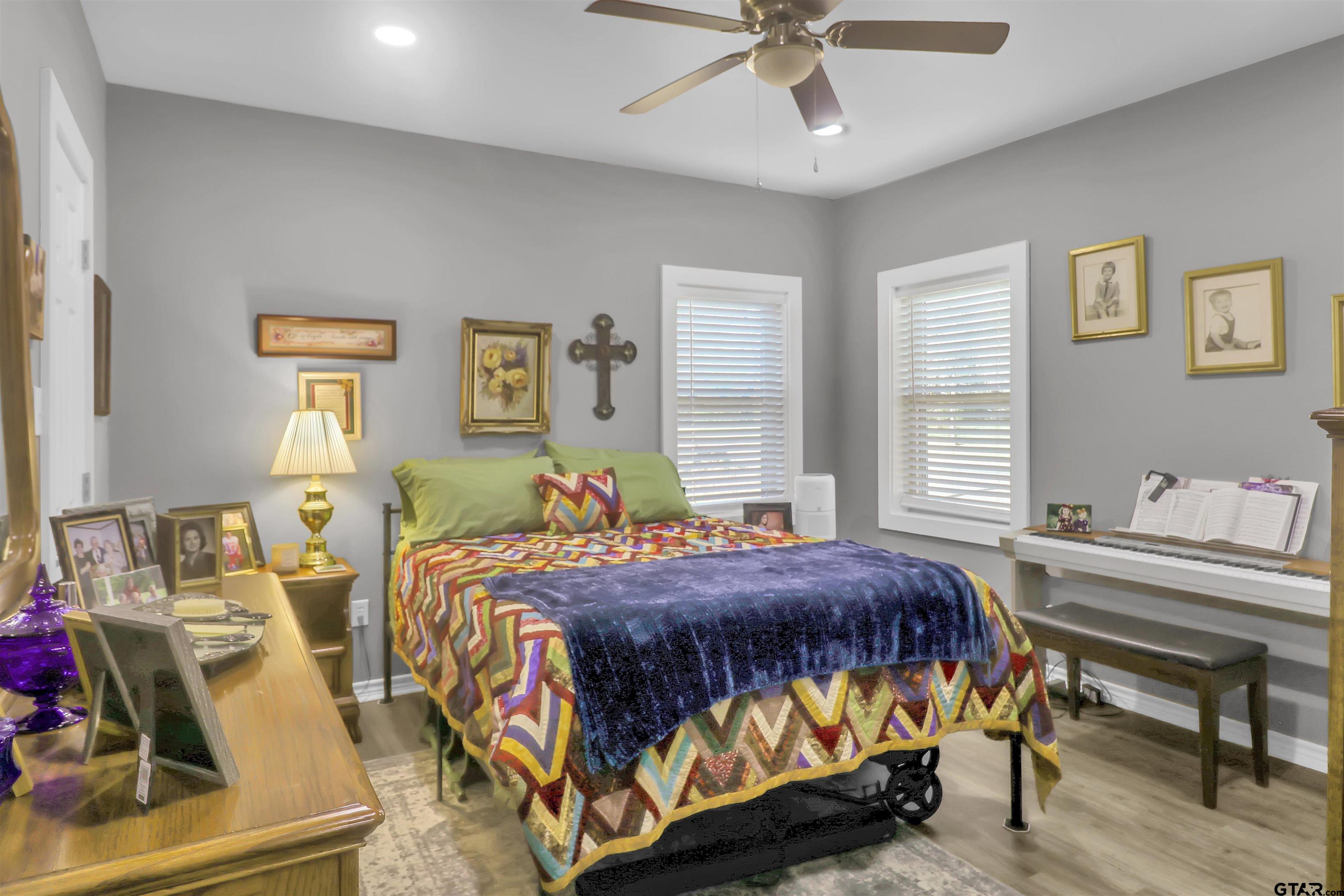 554 East San Antonio Street Alto, TX 75925 - Photo 14 of 28 a bedroom with a bed and wooden floor