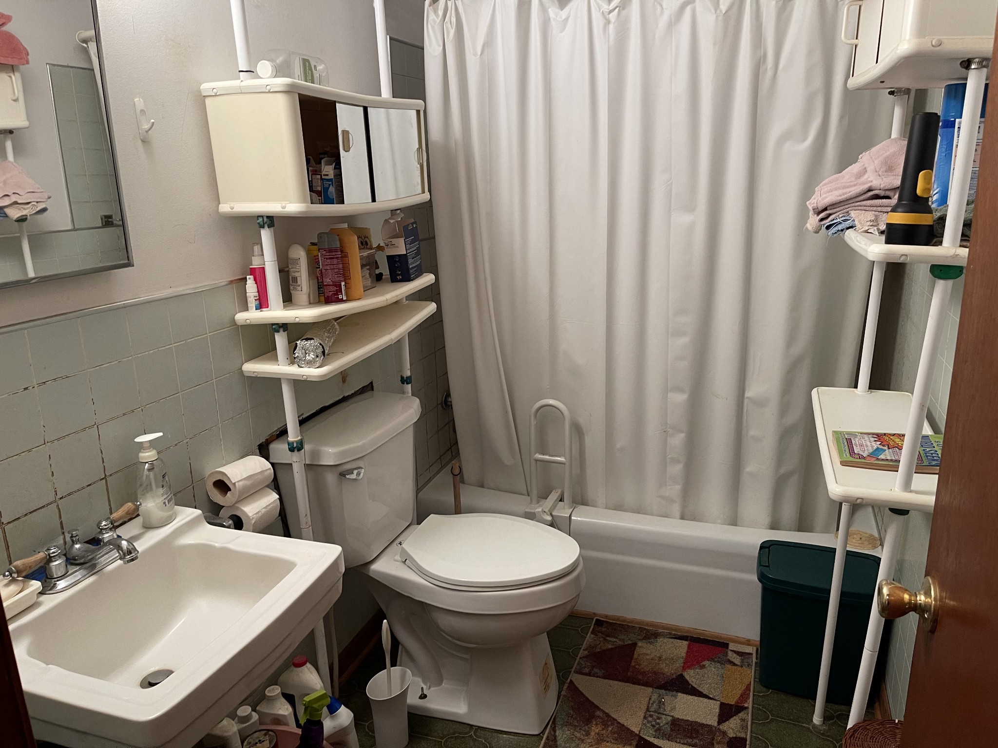 2217 Lemont And Yates Mountain Road Spencer, TN 38585 - Photo 25 of 36 a bathroom with a sink a toilet and a mirror