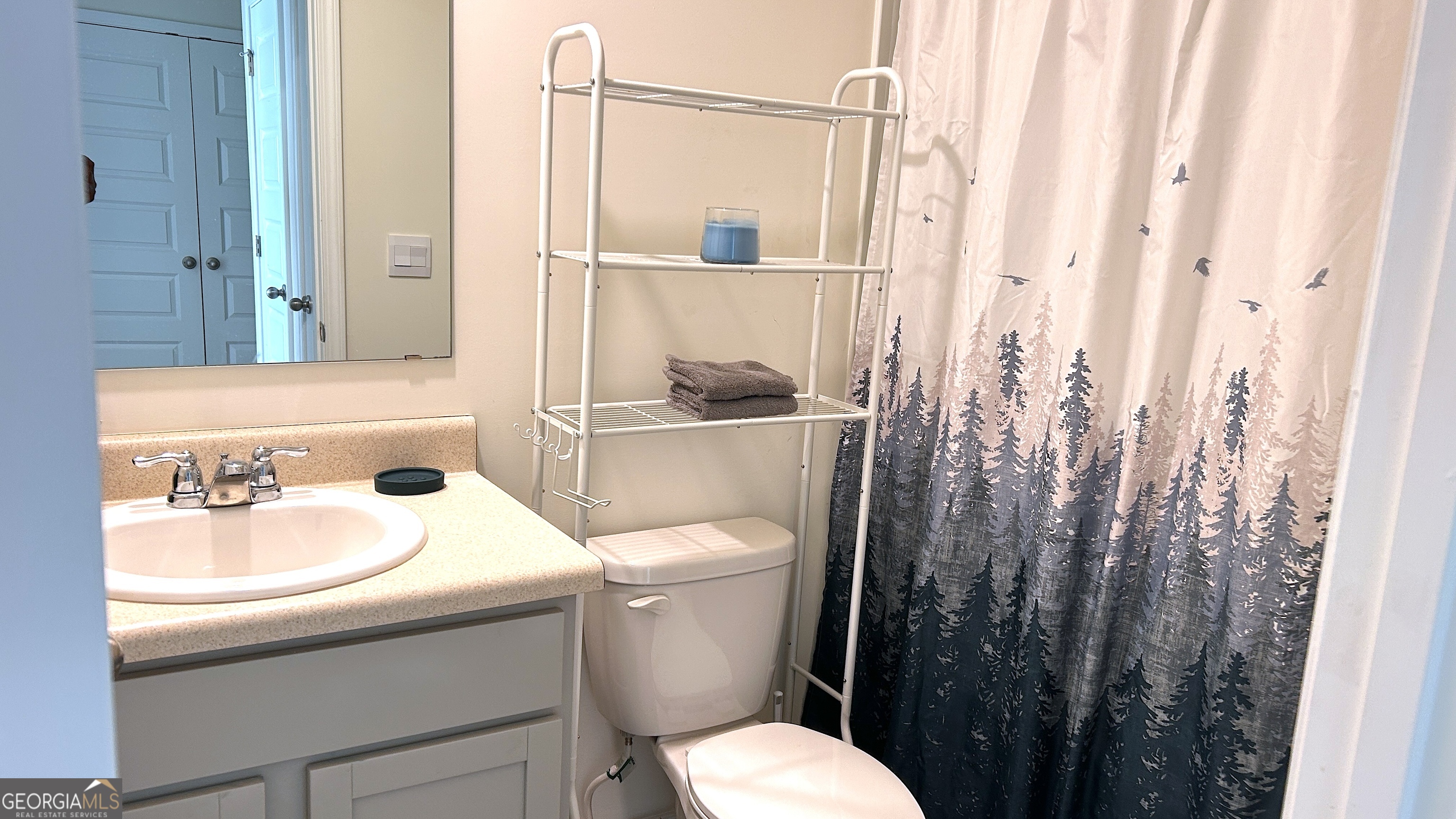 837 Taurus Drive Stockbridge, GA 30281 - Photo 15 of 20 a white toilet sitting next to a bathroom sink