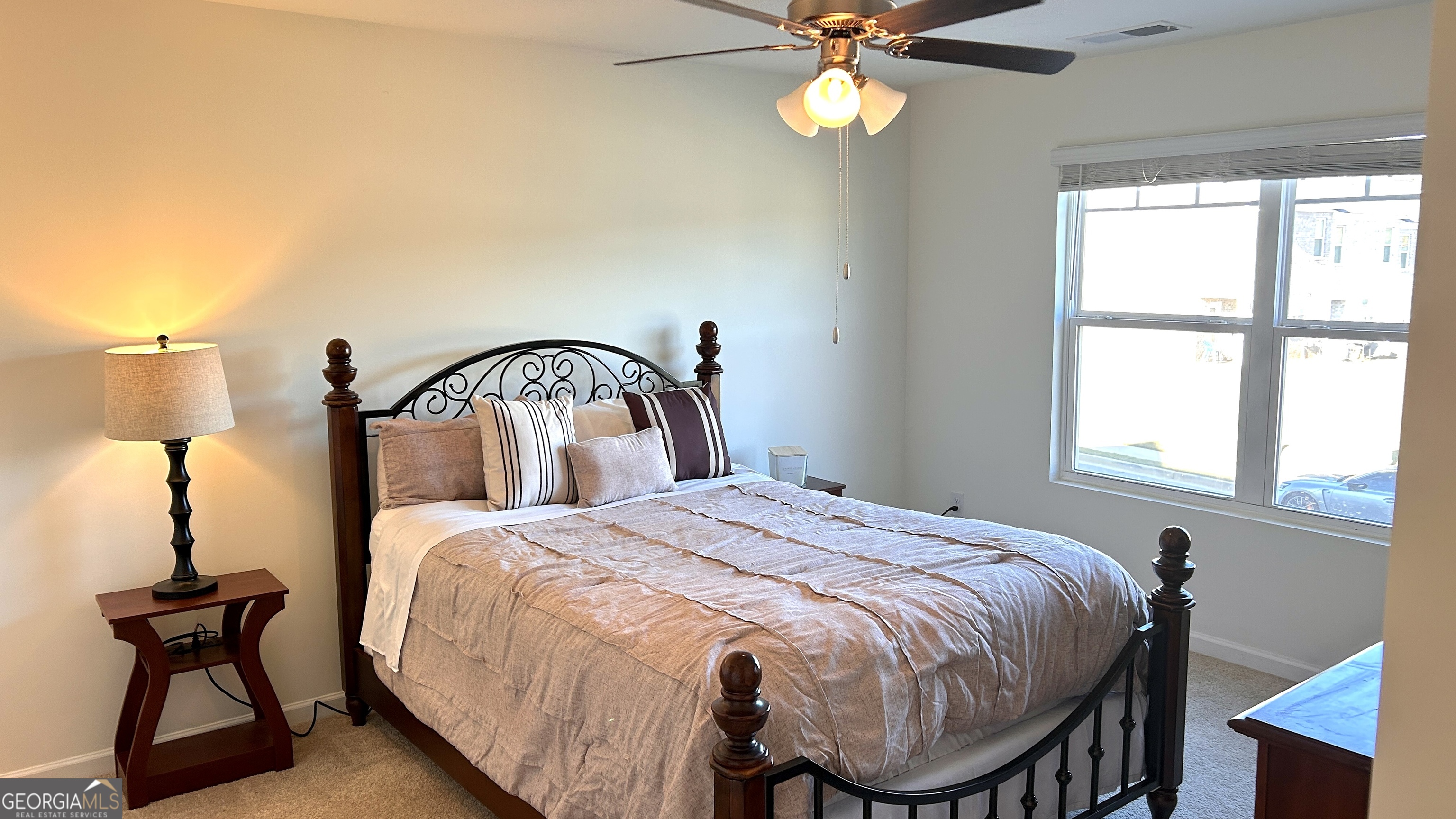 837 Taurus Drive Stockbridge, GA 30281 - Photo 8 of 20 a bedroom with a bed and a window