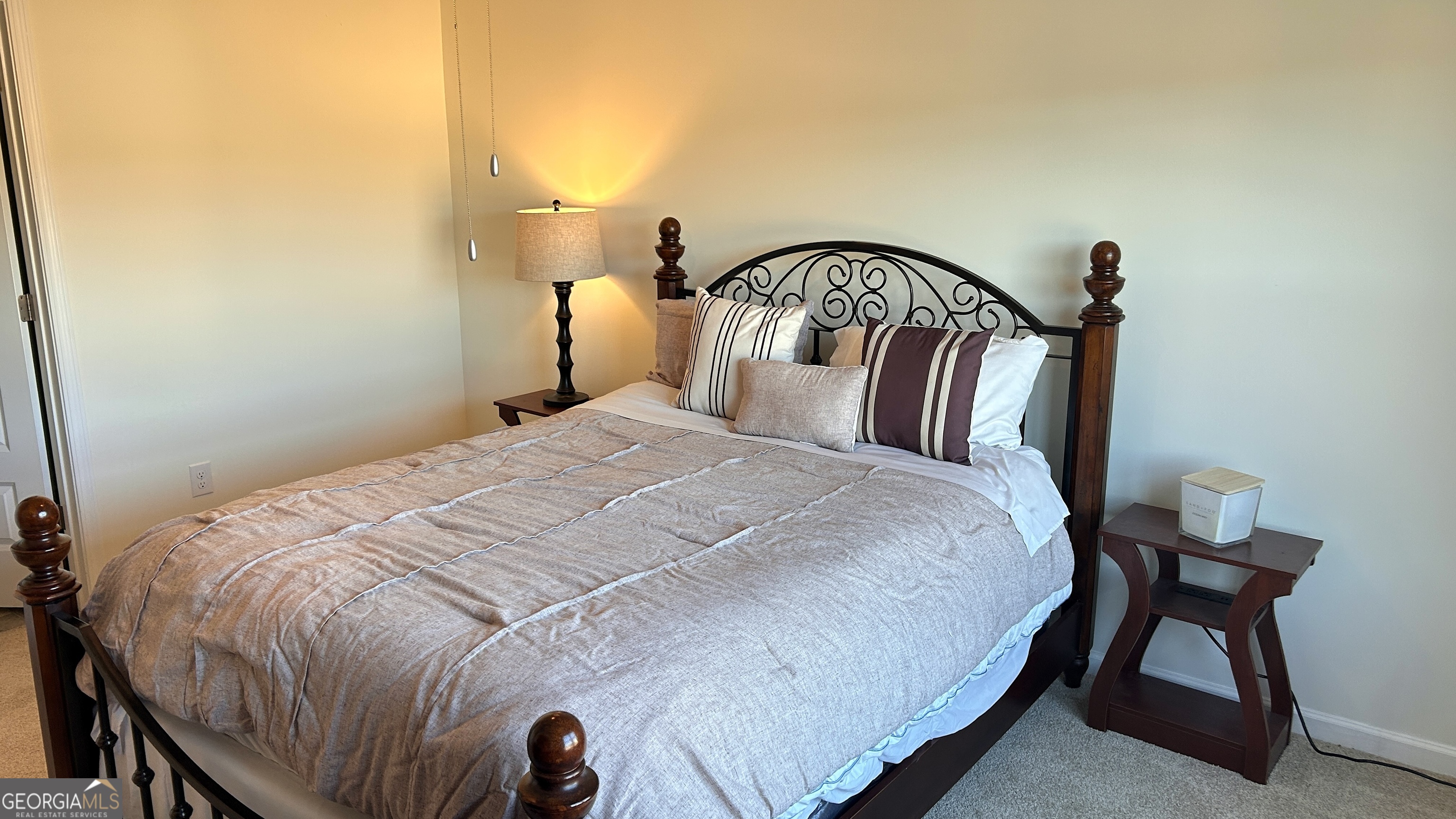 837 Taurus Drive Stockbridge, GA 30281 - Photo 9 of 20 a bedroom with a bed and a table