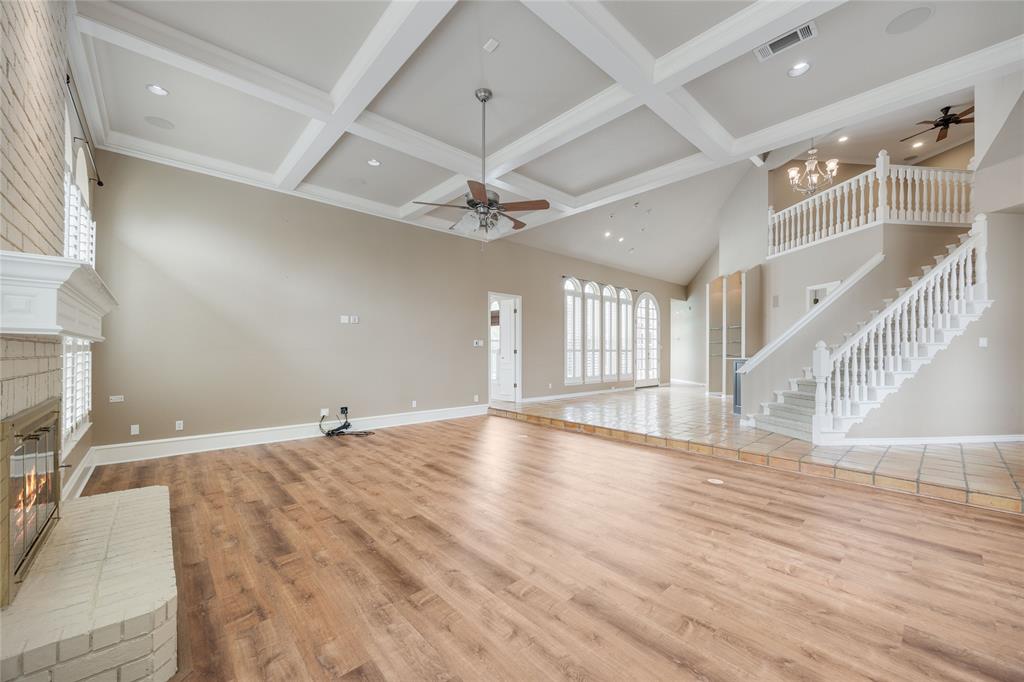 1201 Findlay Drive Arlington, TX 76012 - Photo 8 of 35 a view of an empty room with wooden floor and a ceiling fan