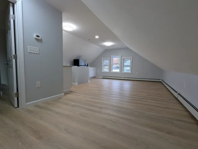 a view of livingroom and hall with wooden floor