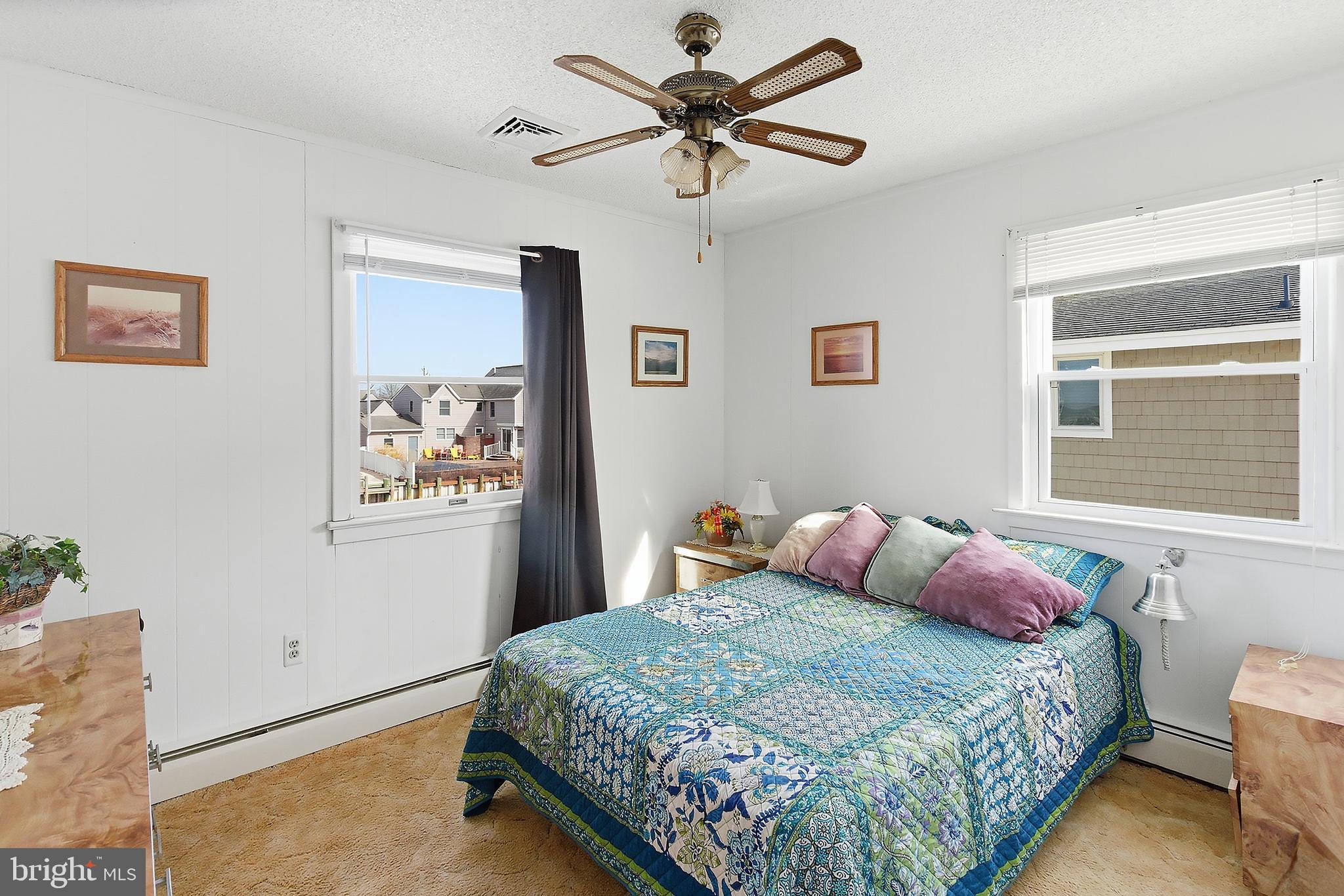 329 West 5th Street Ship Bottom, NJ 08008 - Photo 19 of 47 a bedroom with a bed and a window