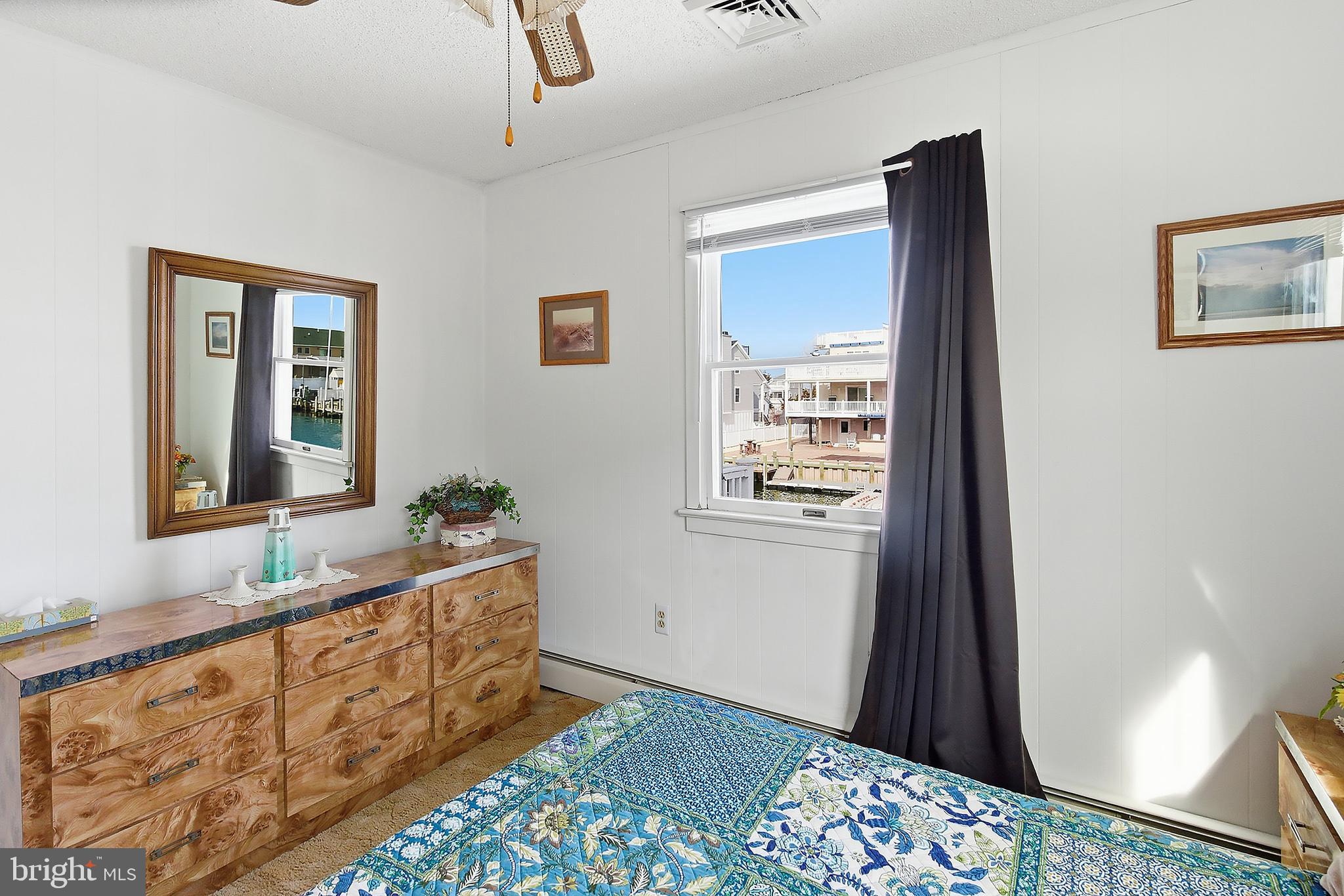 329 West 5th Street Ship Bottom, NJ 08008 - Photo 20 of 47 a living room with a bed furniture and a window