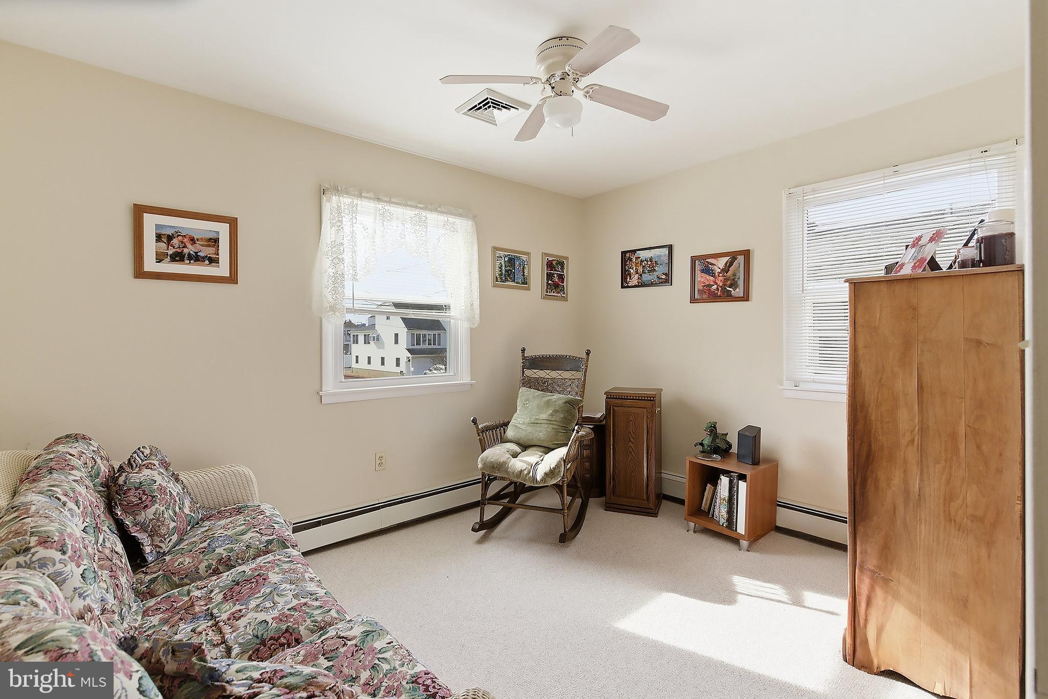 329 West 5th Street Ship Bottom, NJ 08008 - Photo 21 of 47 a bedroom with furniture and a window