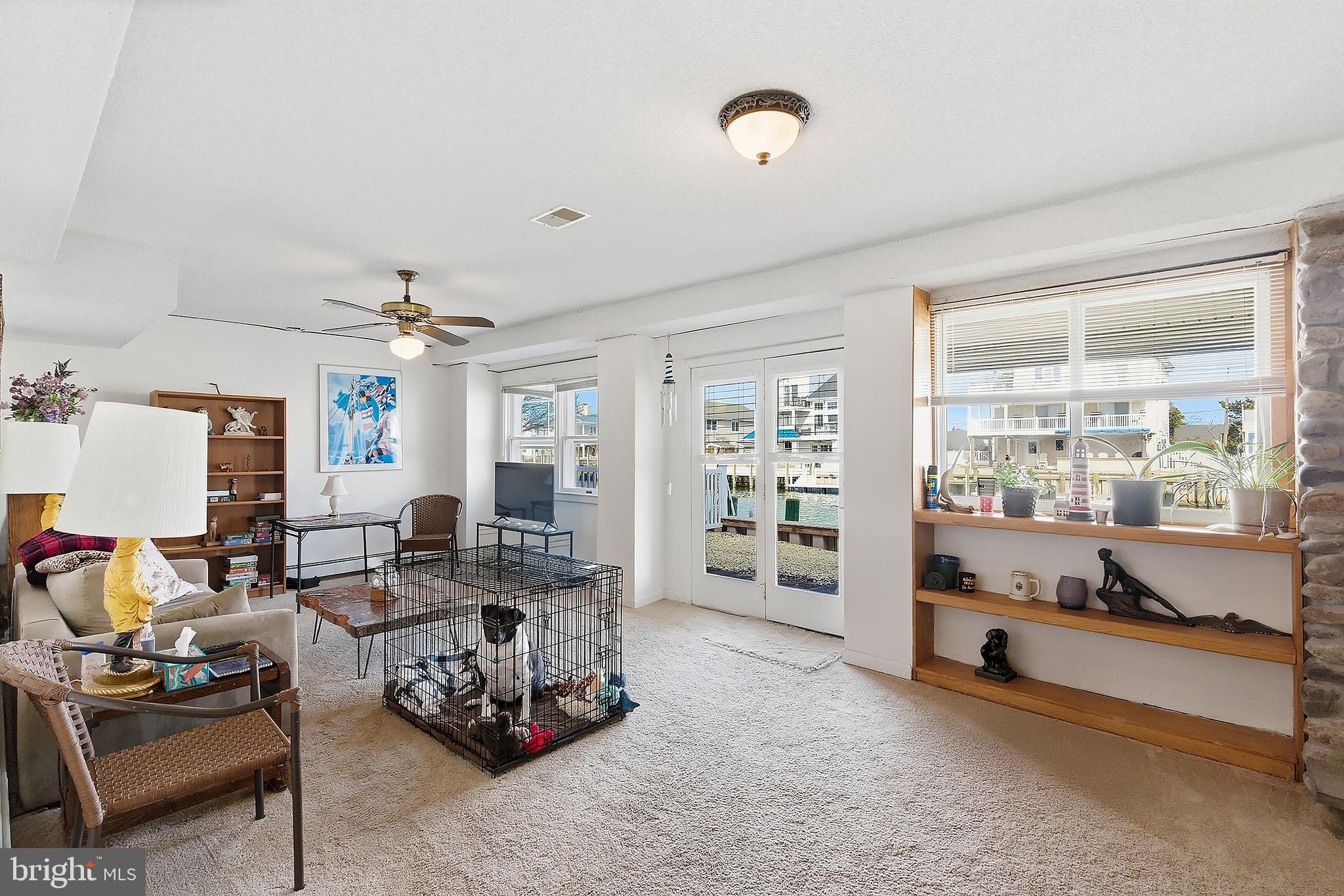 329 West 5th Street Ship Bottom, NJ 08008 - Photo 27 of 47 a living room with furniture and a large window