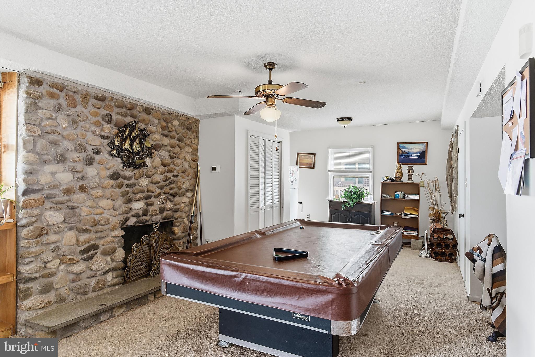 329 West 5th Street Ship Bottom, NJ 08008 - Photo 28 of 47 a room with pool table and ceiling fan