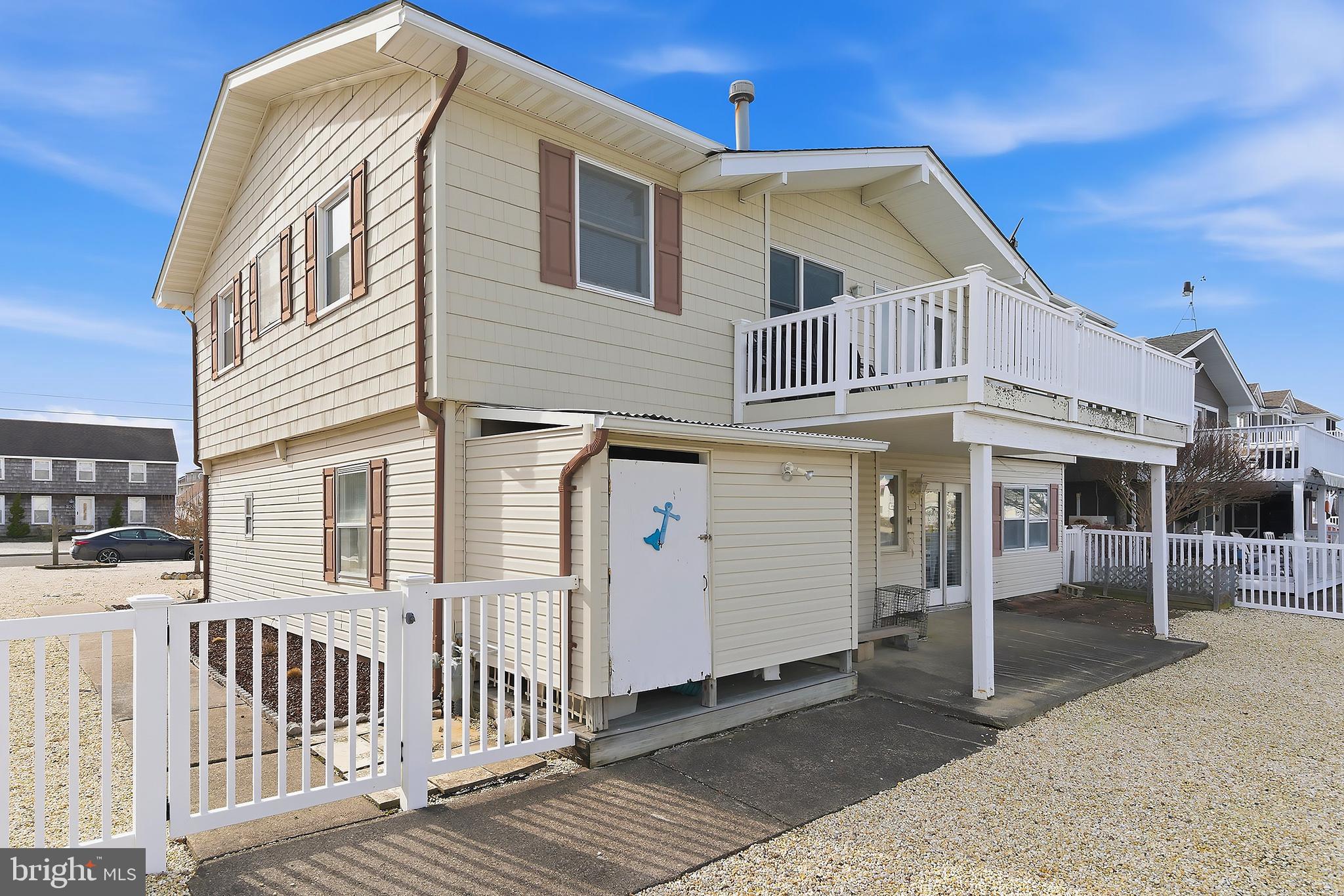 329 West 5th Street Ship Bottom, NJ 08008 - Photo 37 of 47 a view of a house with a yard