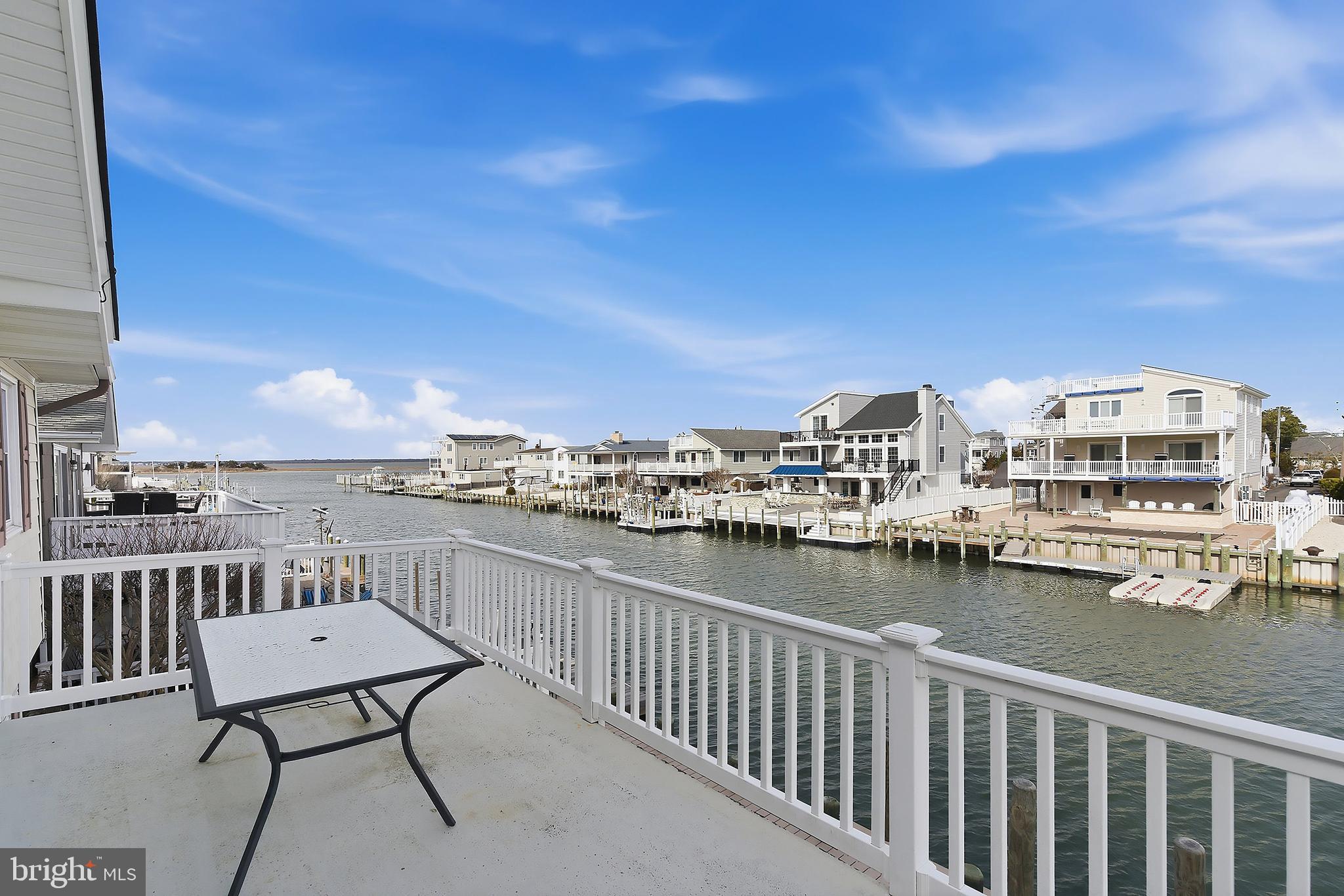 329 West 5th Street Ship Bottom, NJ 08008 - Photo 8 of 47 a view of a balcony with chairs
