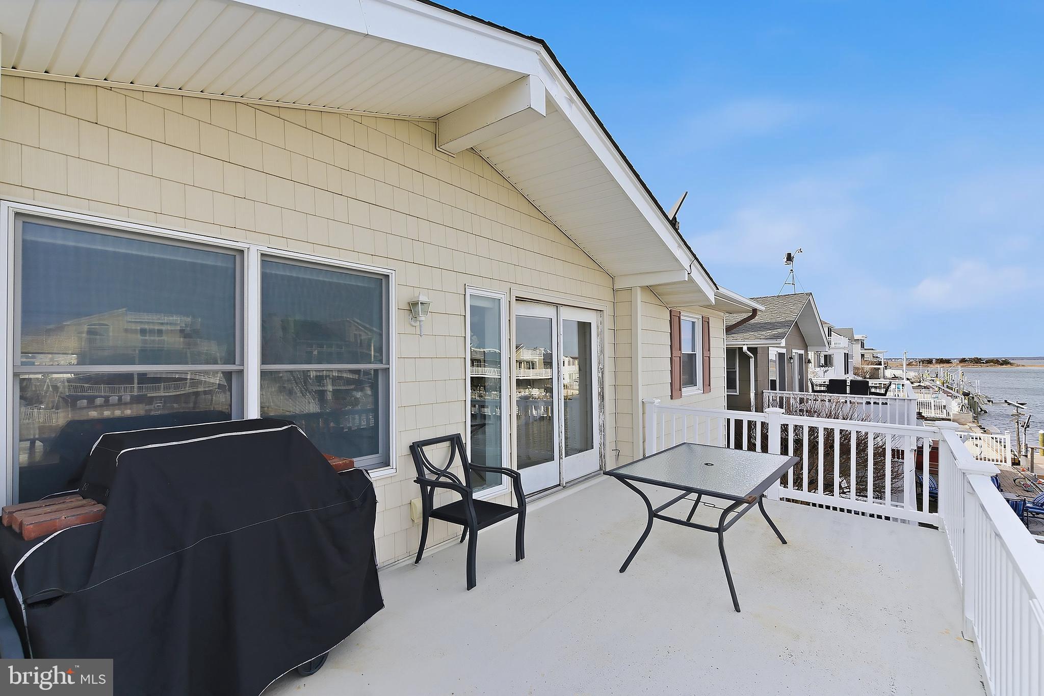 329 West 5th Street Ship Bottom, NJ 08008 - Photo 9 of 47 a balcony with furniture