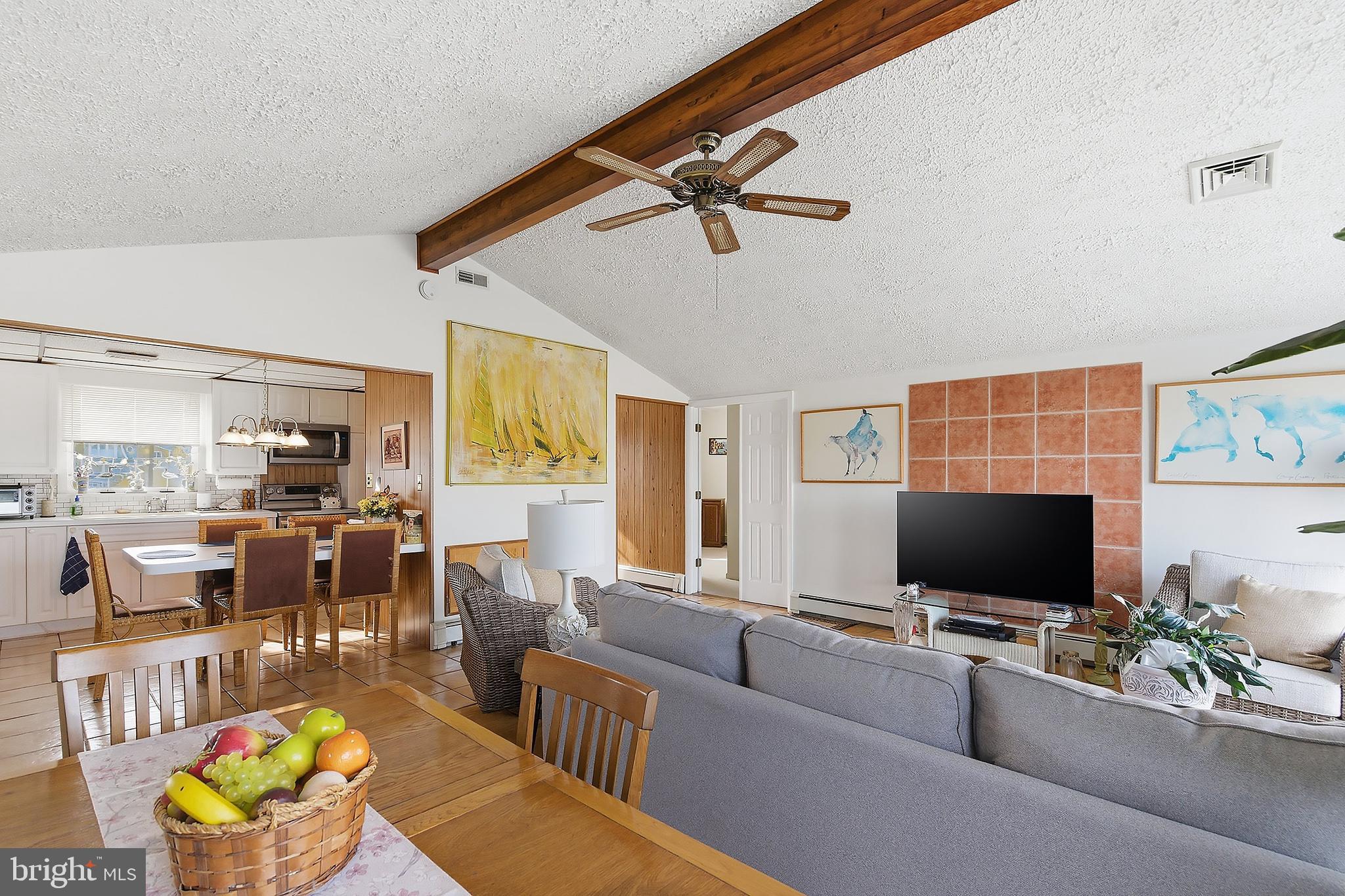 329 West 5th Street Ship Bottom, NJ 08008 - Photo 10 of 47 a living room with furniture and a flat screen tv