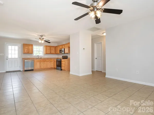 a large kitchen with cabinets and stainless steel appliances