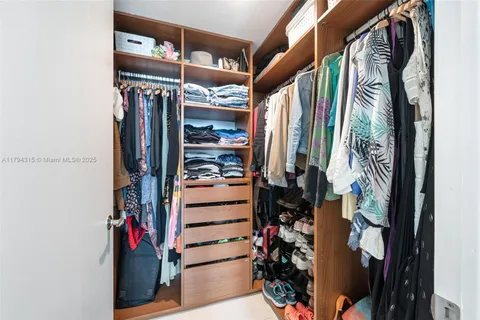 a bathroom with a sink toilet a mirror and shower